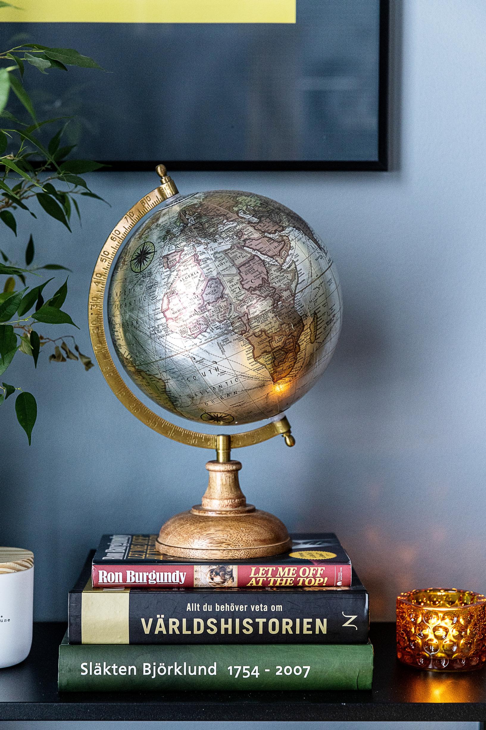 A glossy globe on the living room side table.