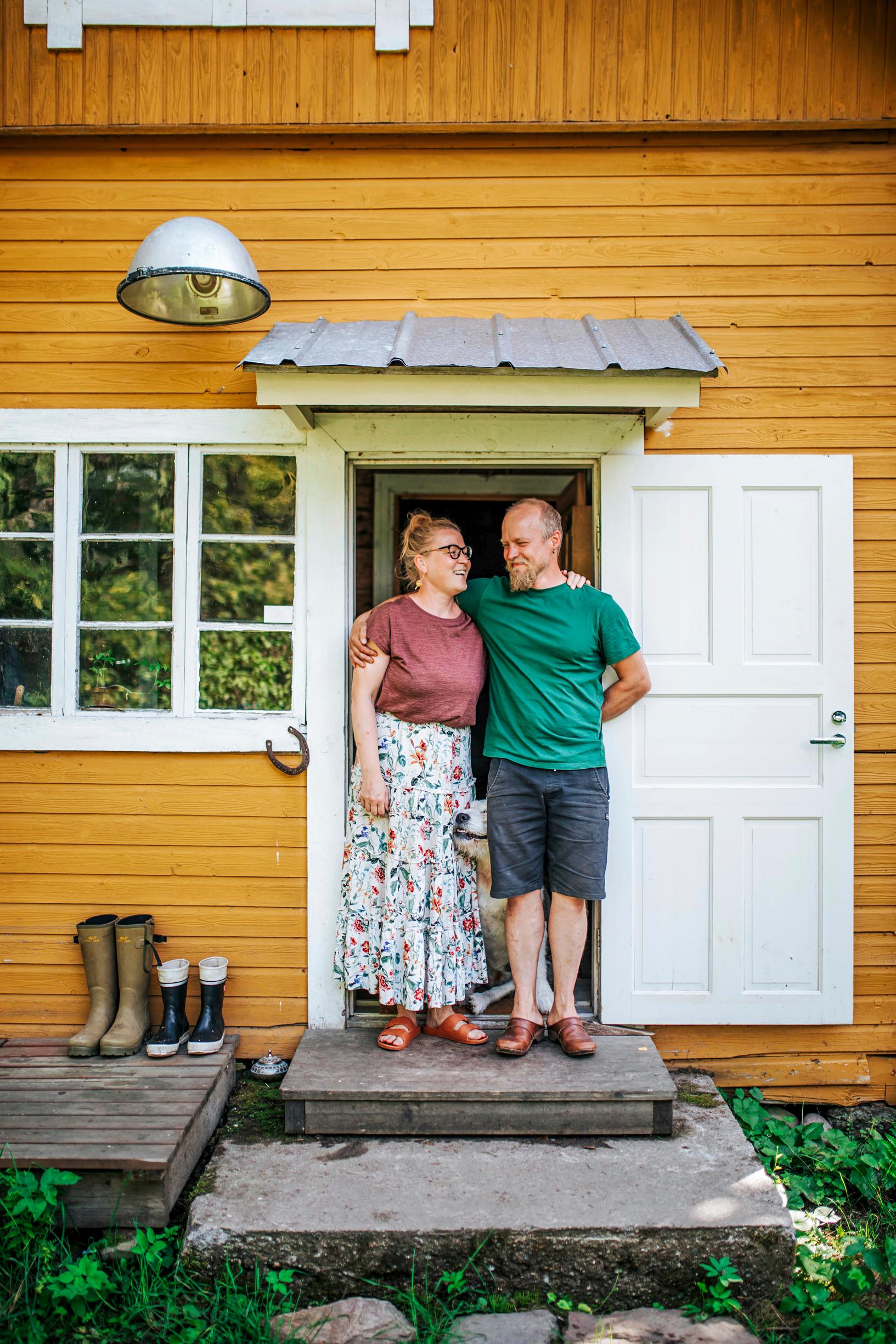 Asta and Ilkka at their front door