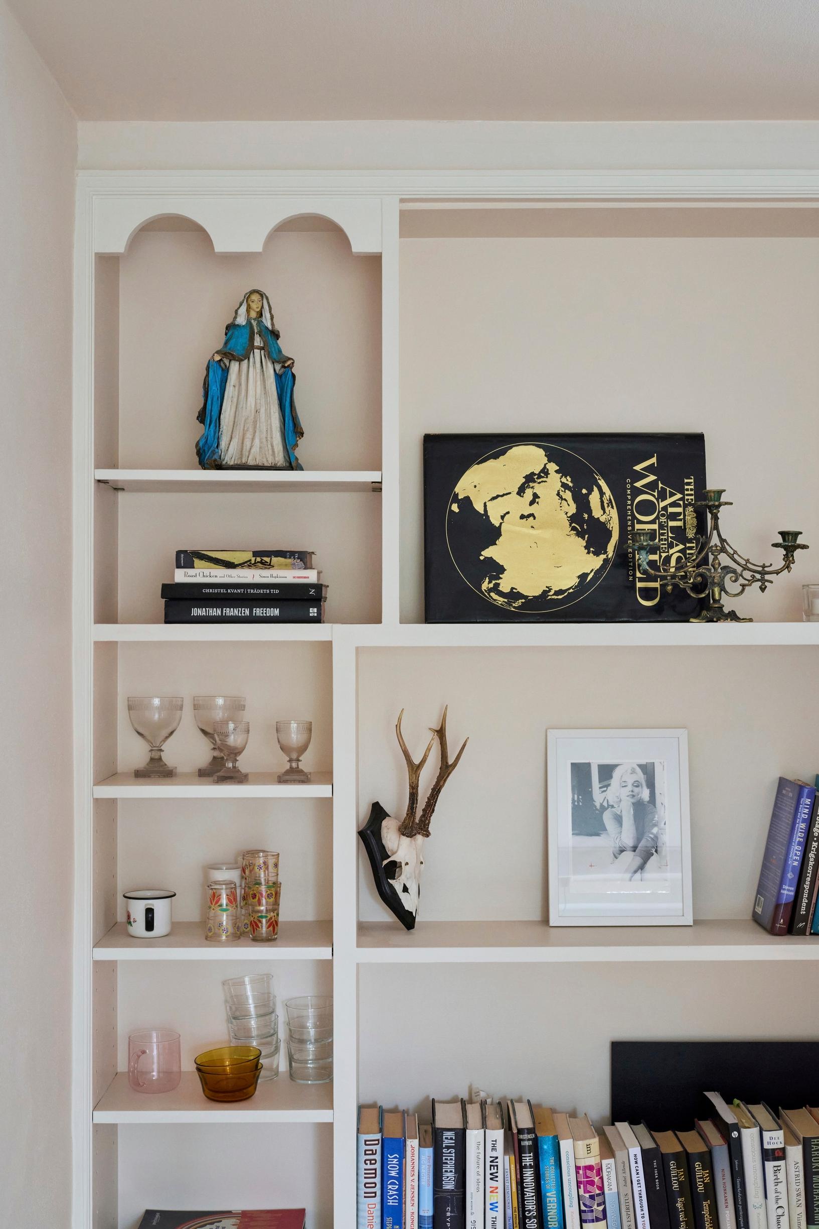A 1960s bookshelf repainted in white