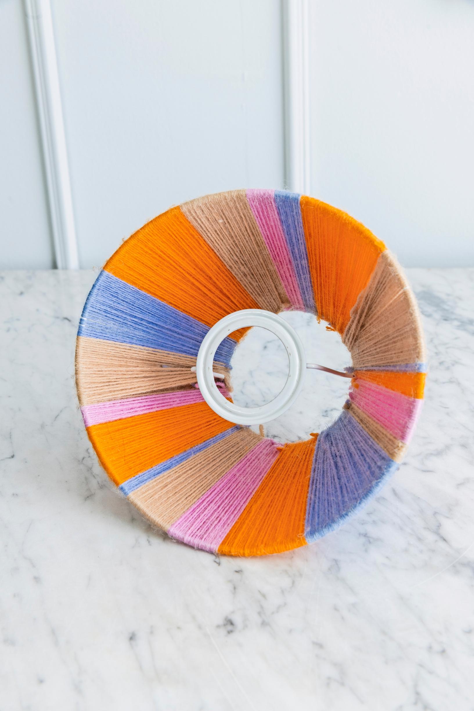 A shade made from wool yarn.