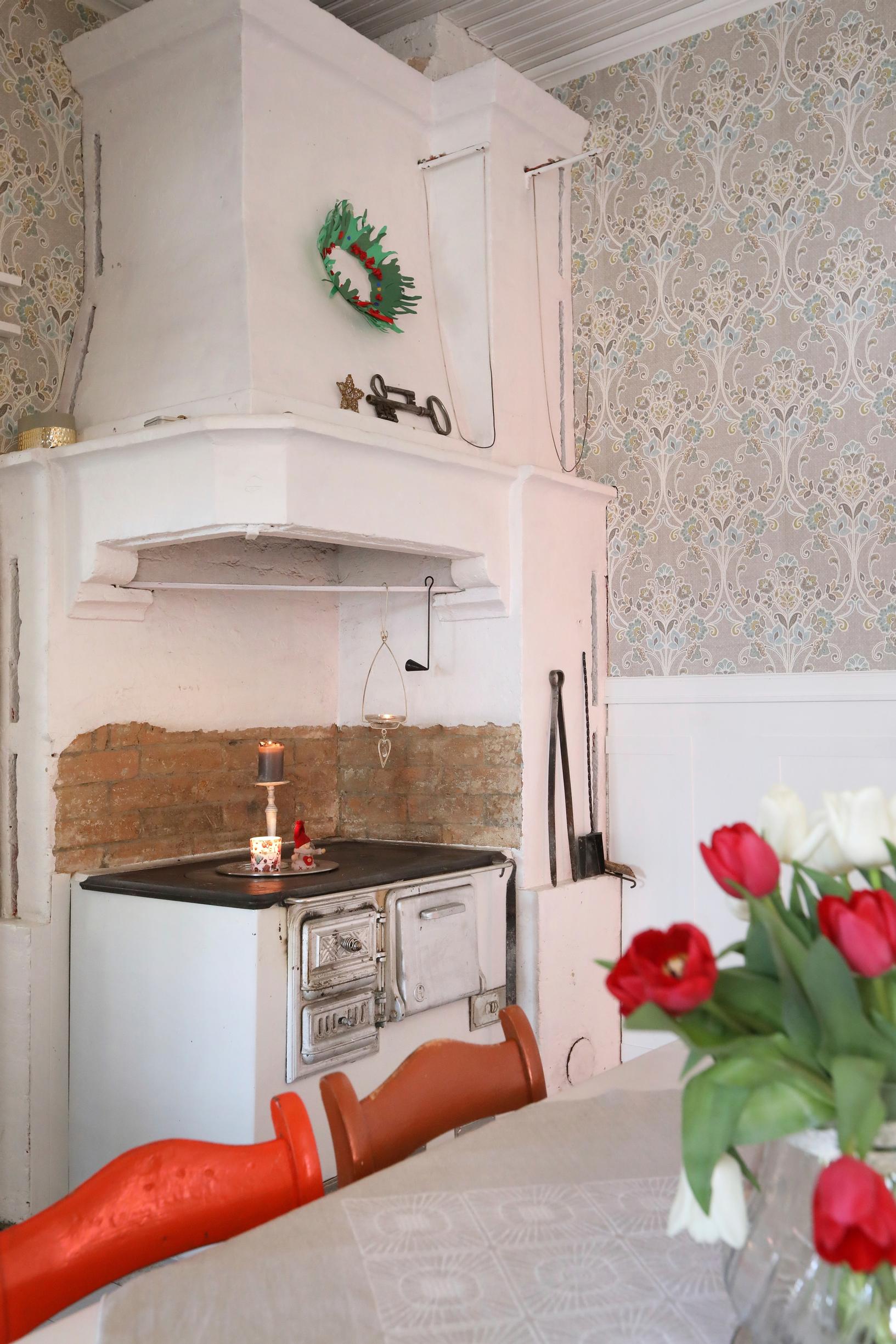 A wood-burning stove in the kitchen corner