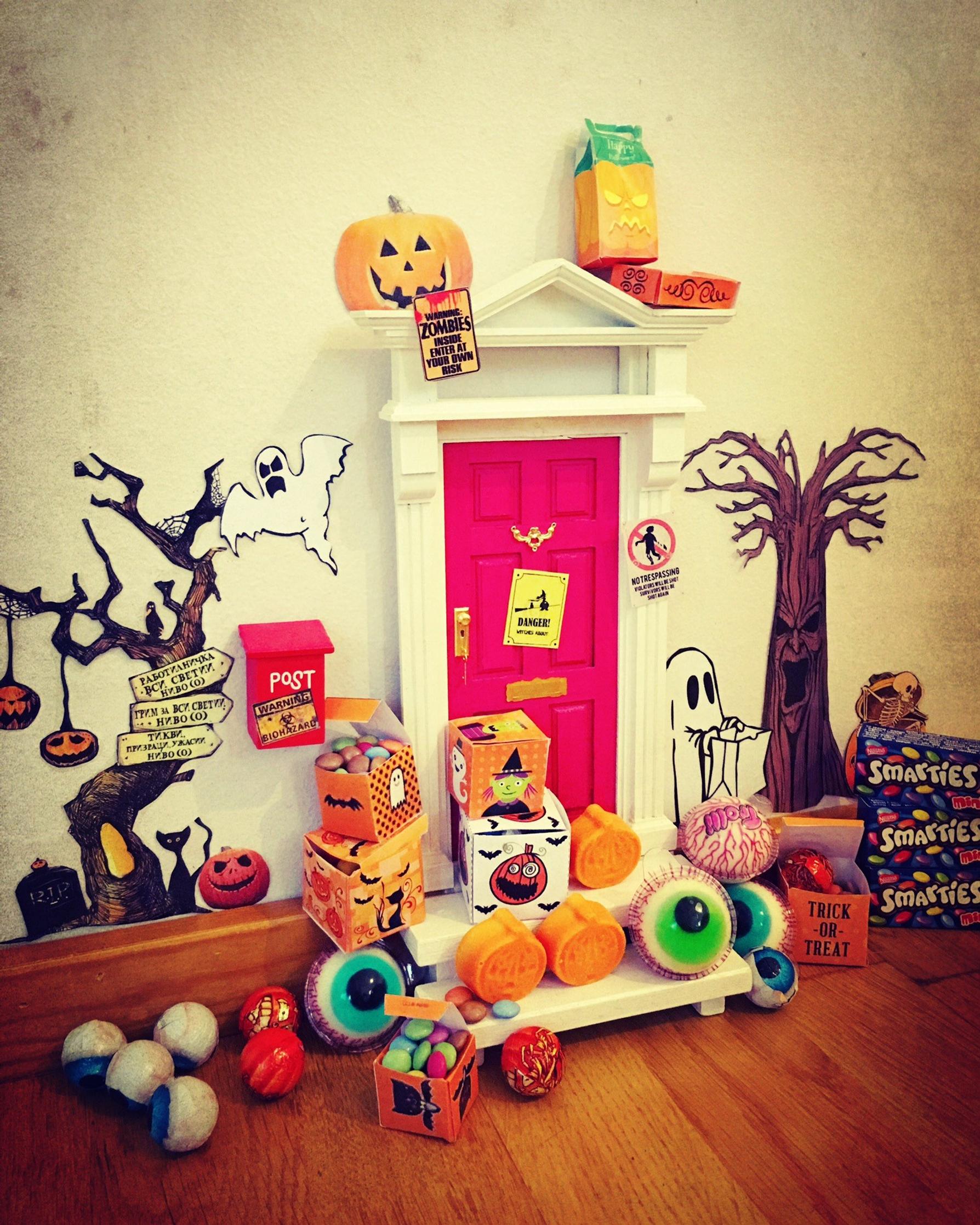 The elf door decorated for Halloween