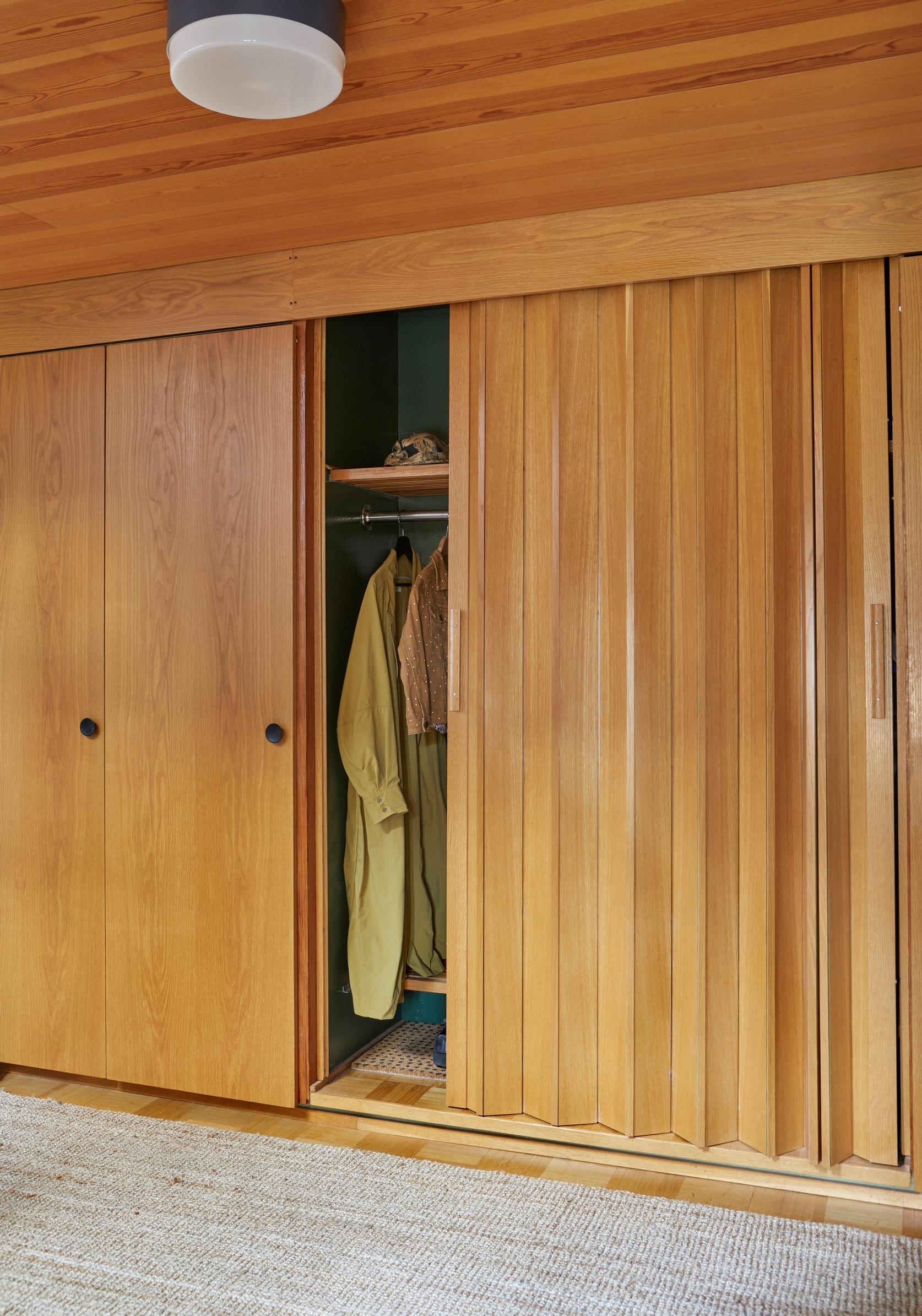 The hallway’s striking original wooden wardrobe.