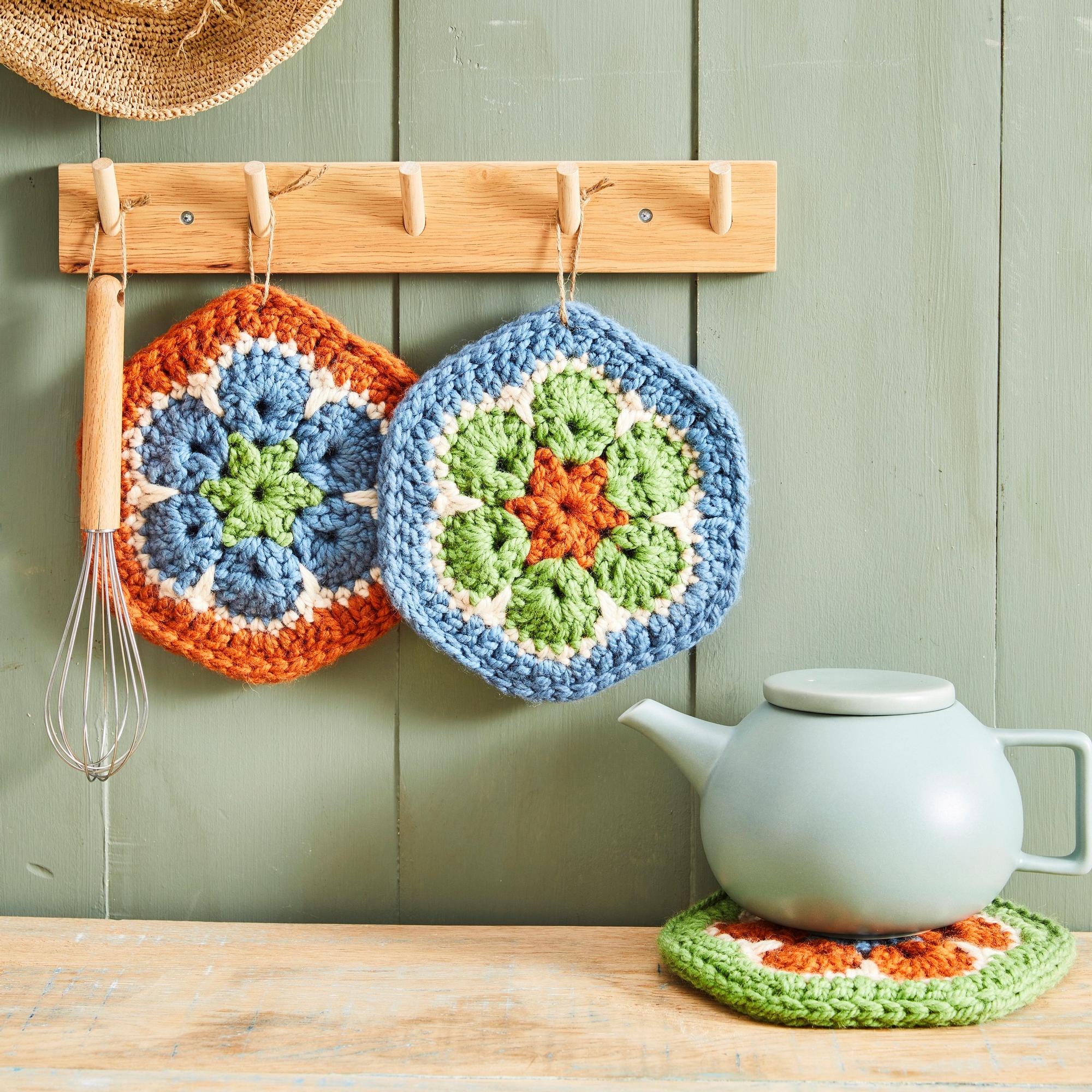 Make your kitchen bloom with these colorful crocheted African flower potholders!