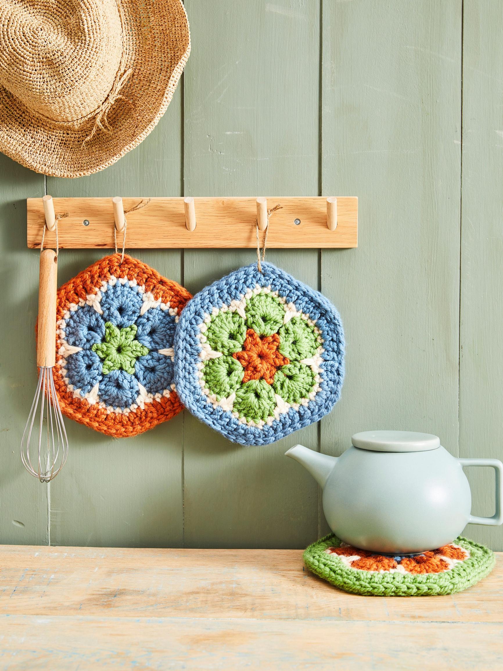Make your kitchen bloom with these colorful crocheted African flower potholders!