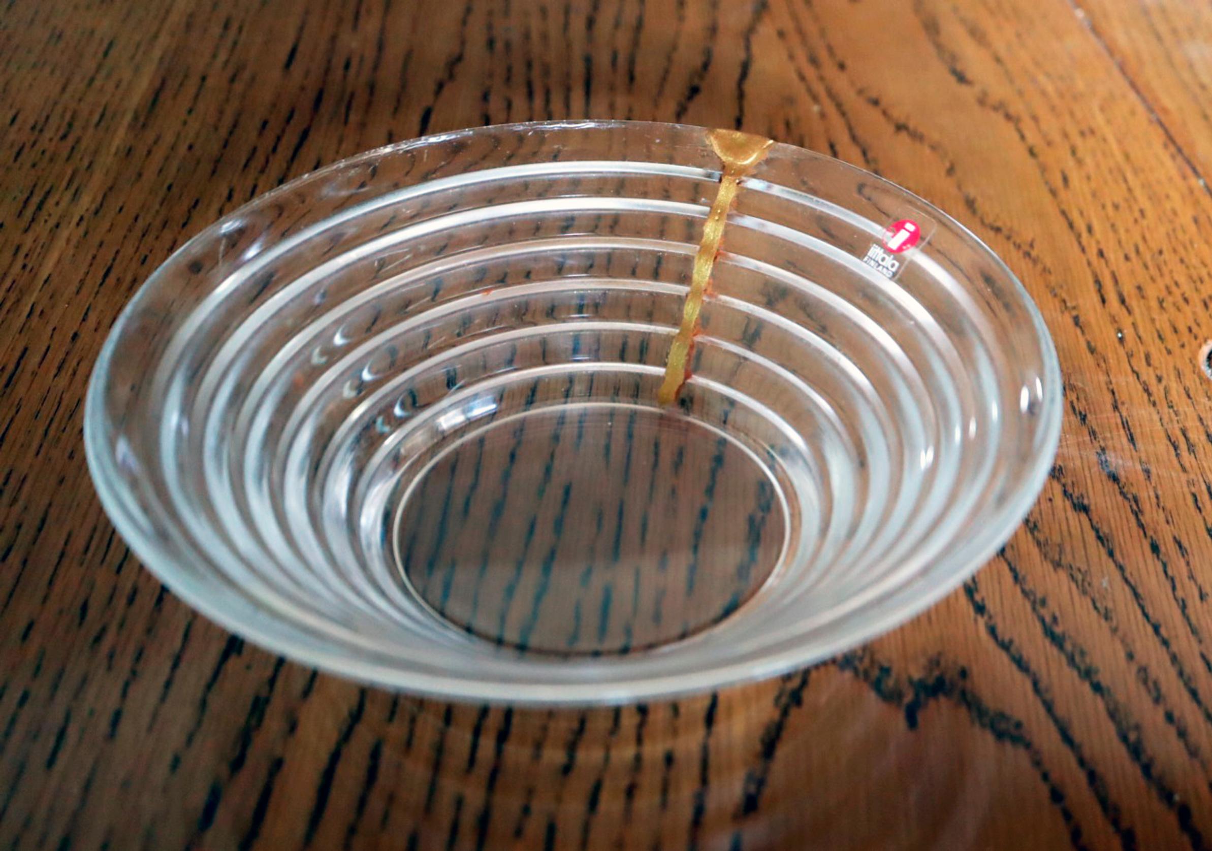 A glass Aino Aalto bowl repaired with the kintsugi technique.