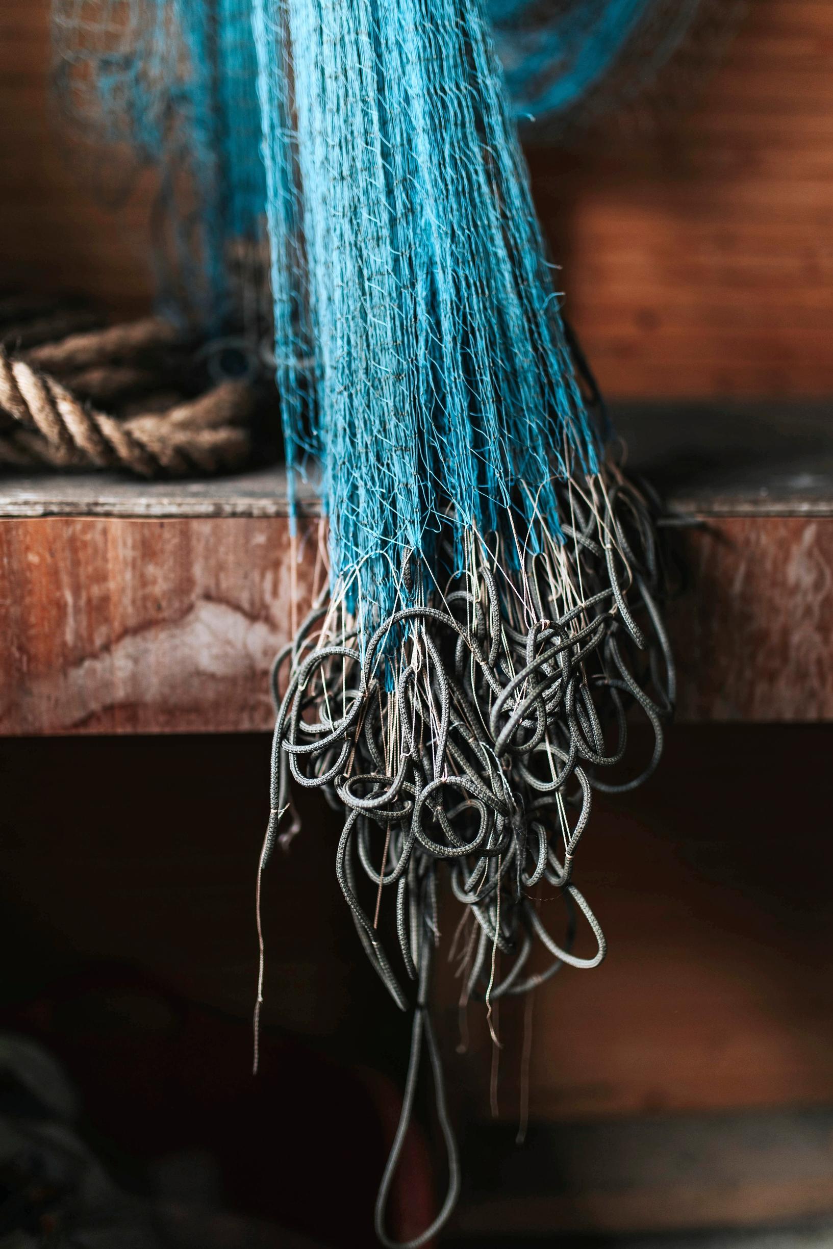 Fishing nets hanging on a wall.