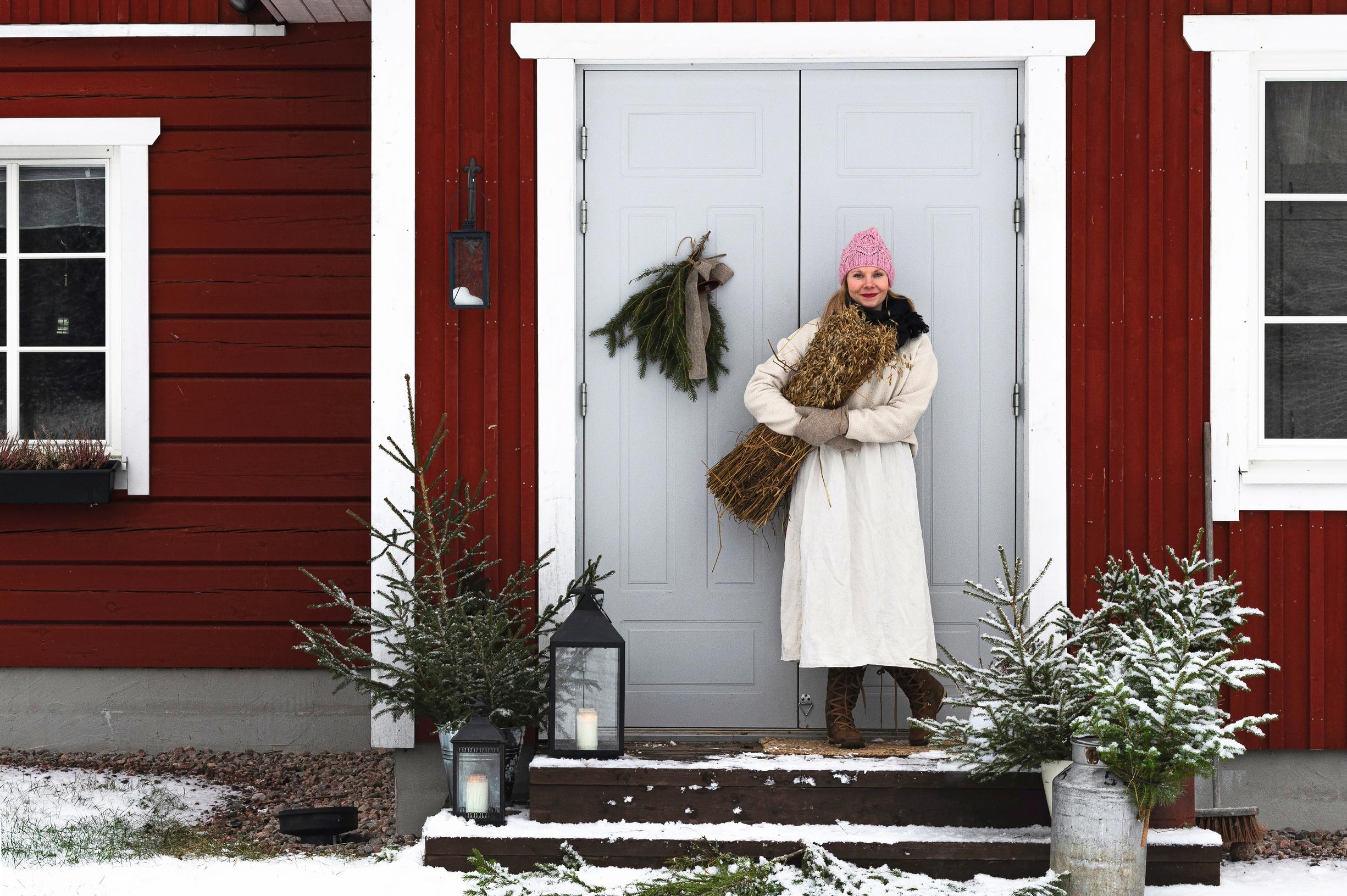 Marianne Rajala standing in front of the exterior door
