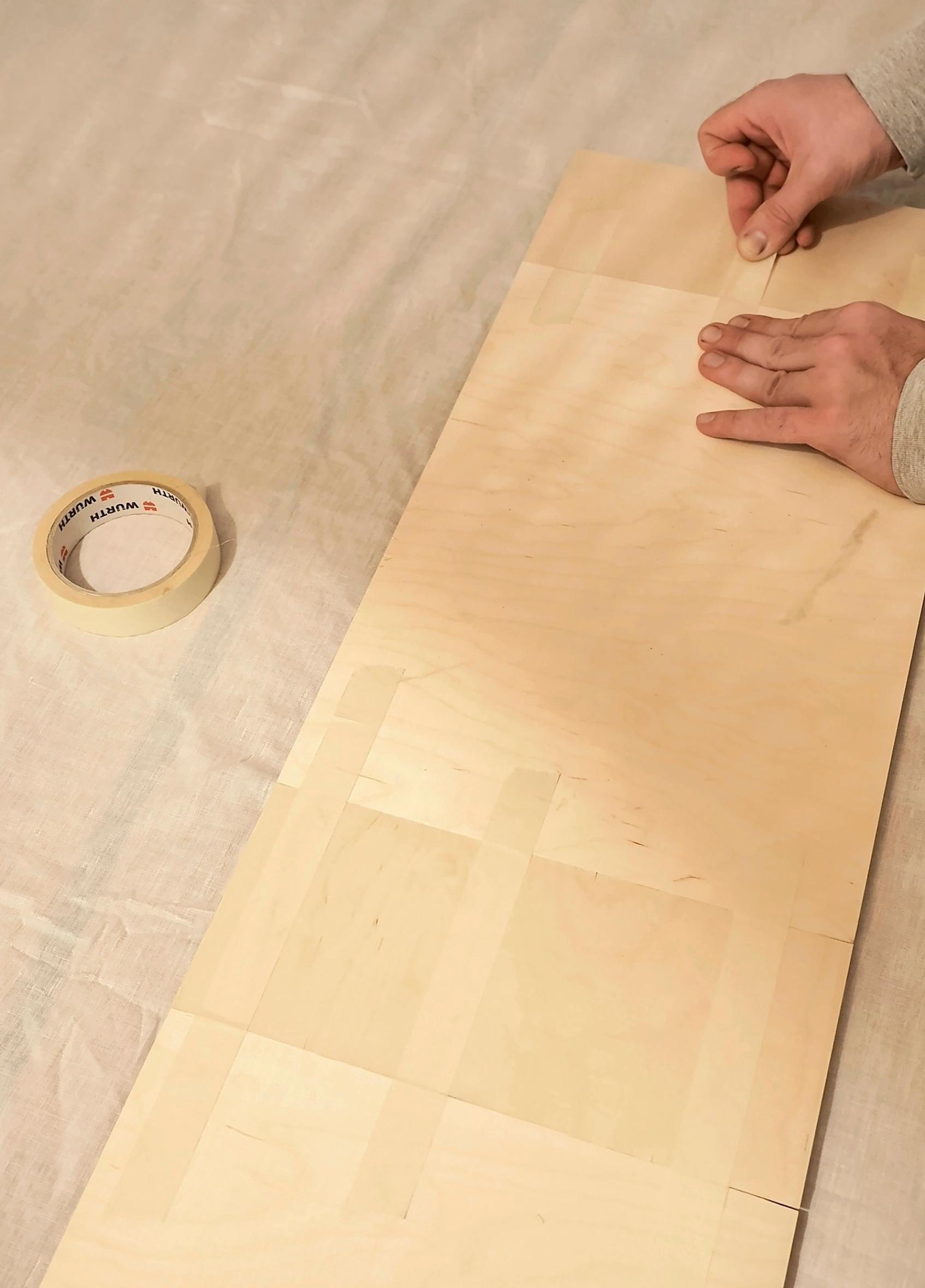 Taping the bedside table’s frame pieces
