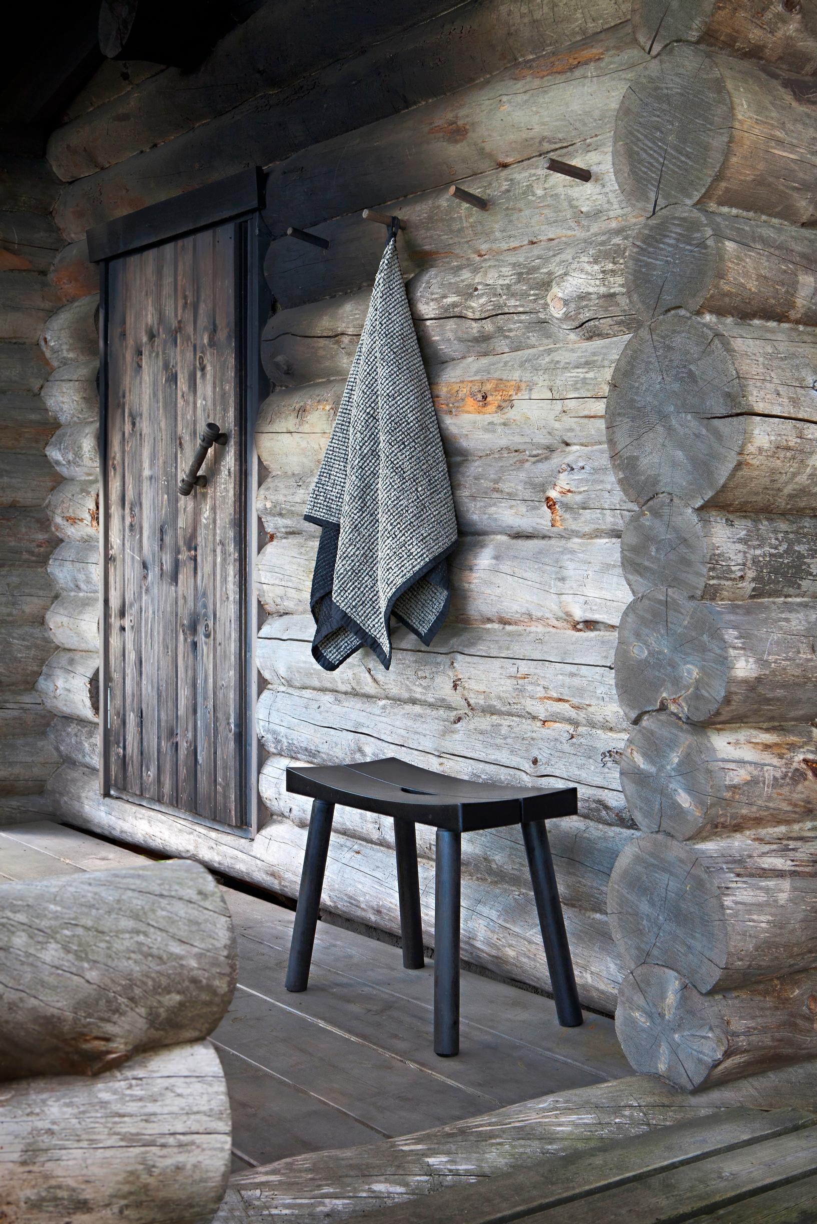 A sauna stool on a porch