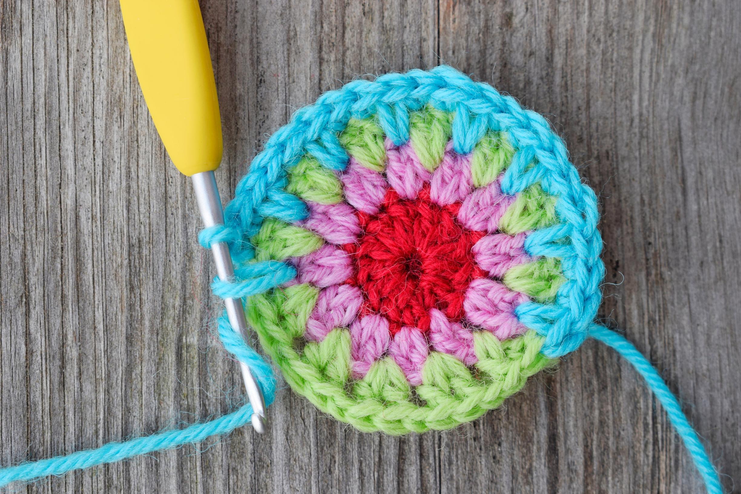 sc into the space between the first dc pair of Round 2 and sc into both dc of the dc pair from the previous round.