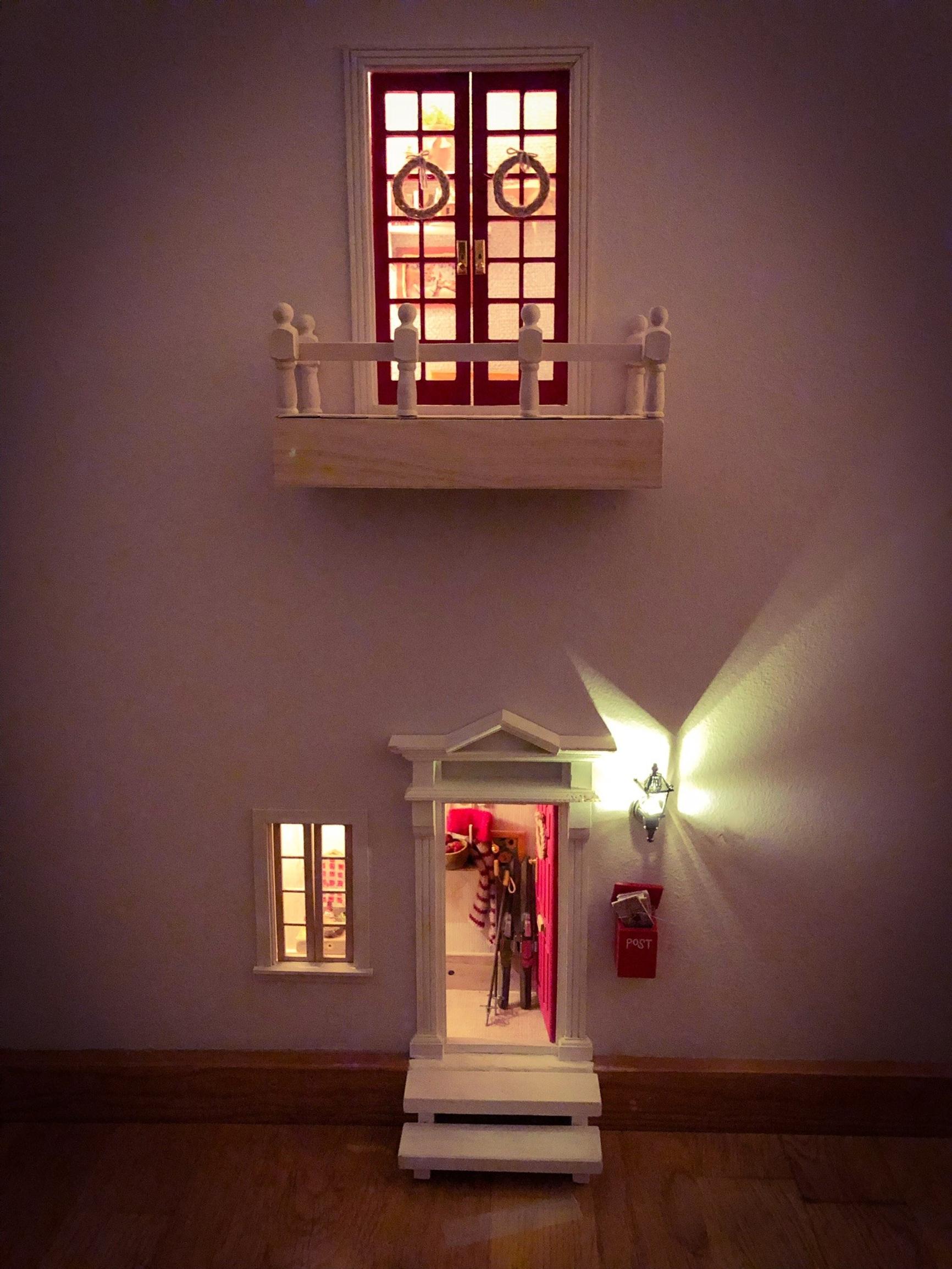 The multi-level elf door lit up with atmospheric lighting