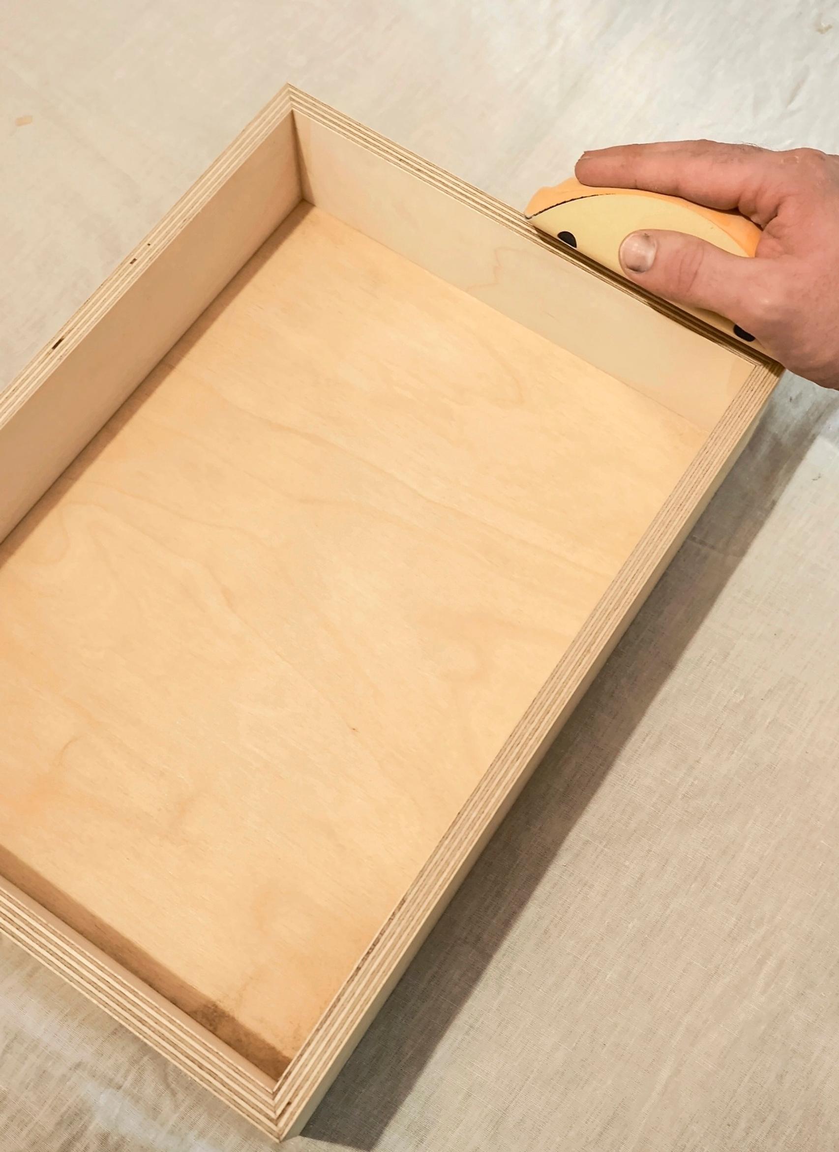 Sanding the final parts of the bedside table