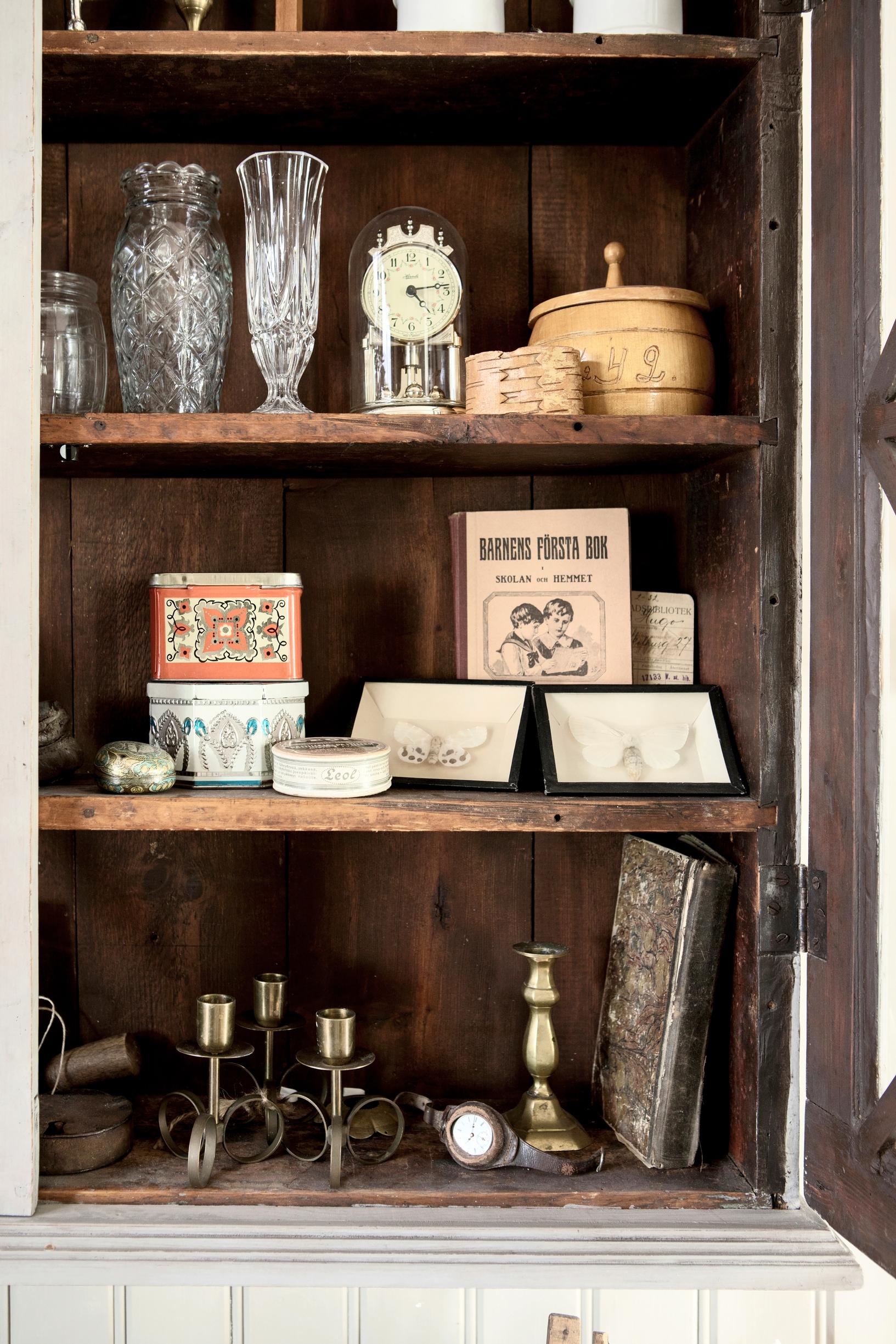 Antique items in the wall cabinet