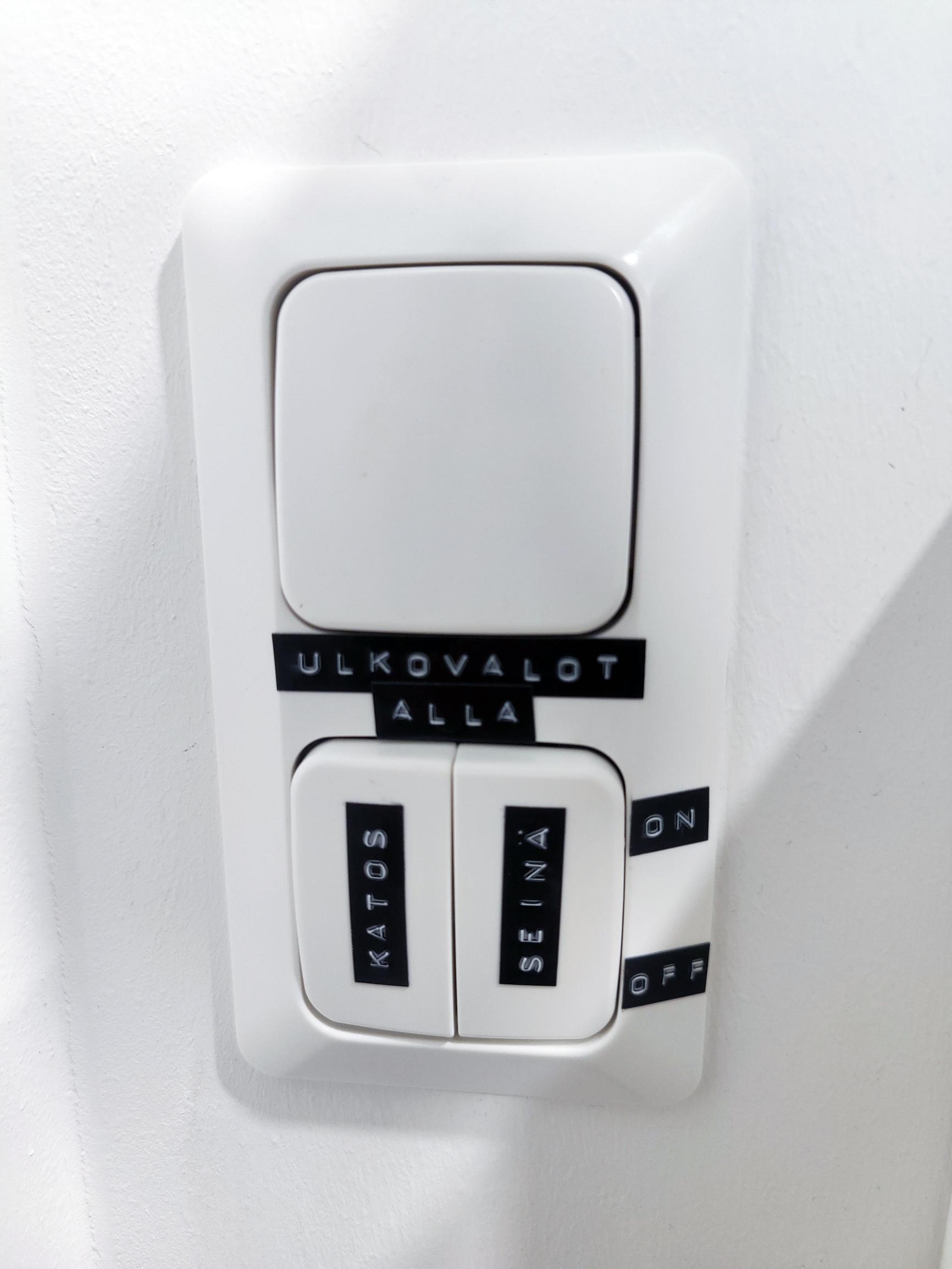 Reminder labels on the entryway light switch.