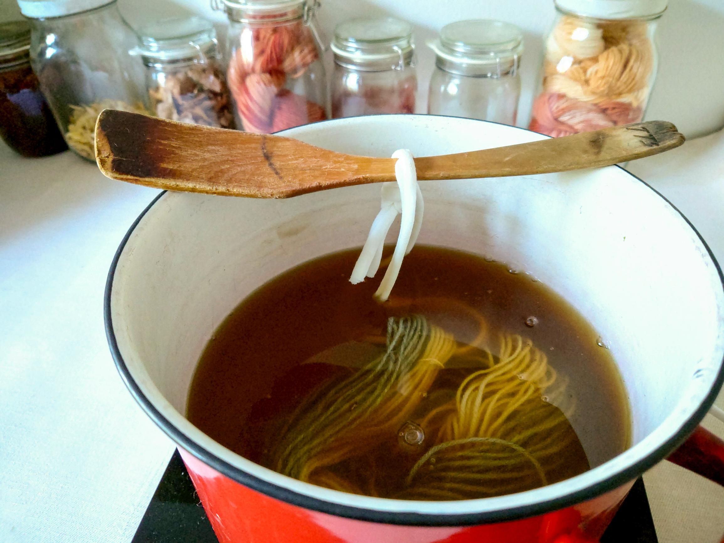Wool yarn in the dye bath.