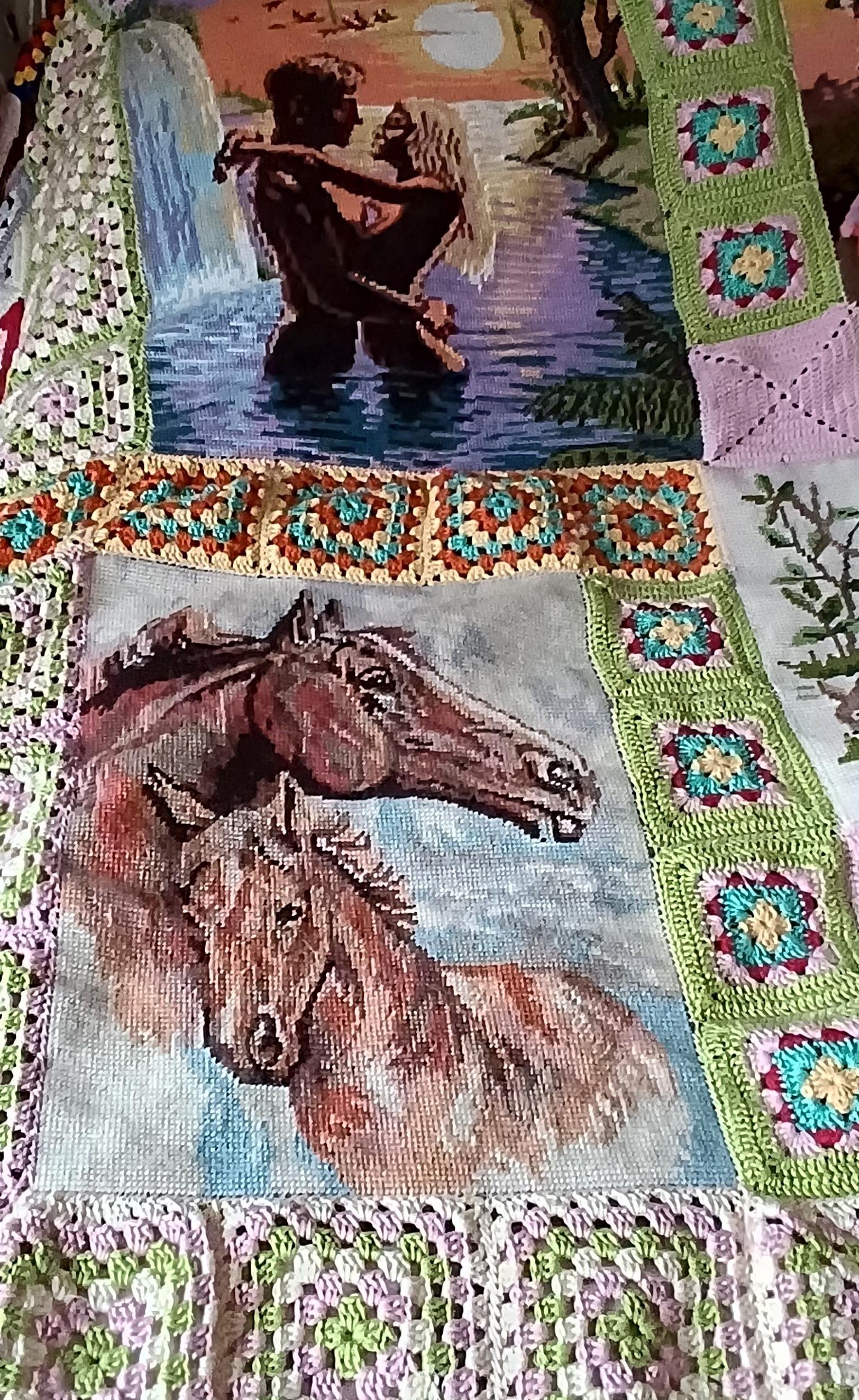 A horse-themed canvas piece in the bedspread.