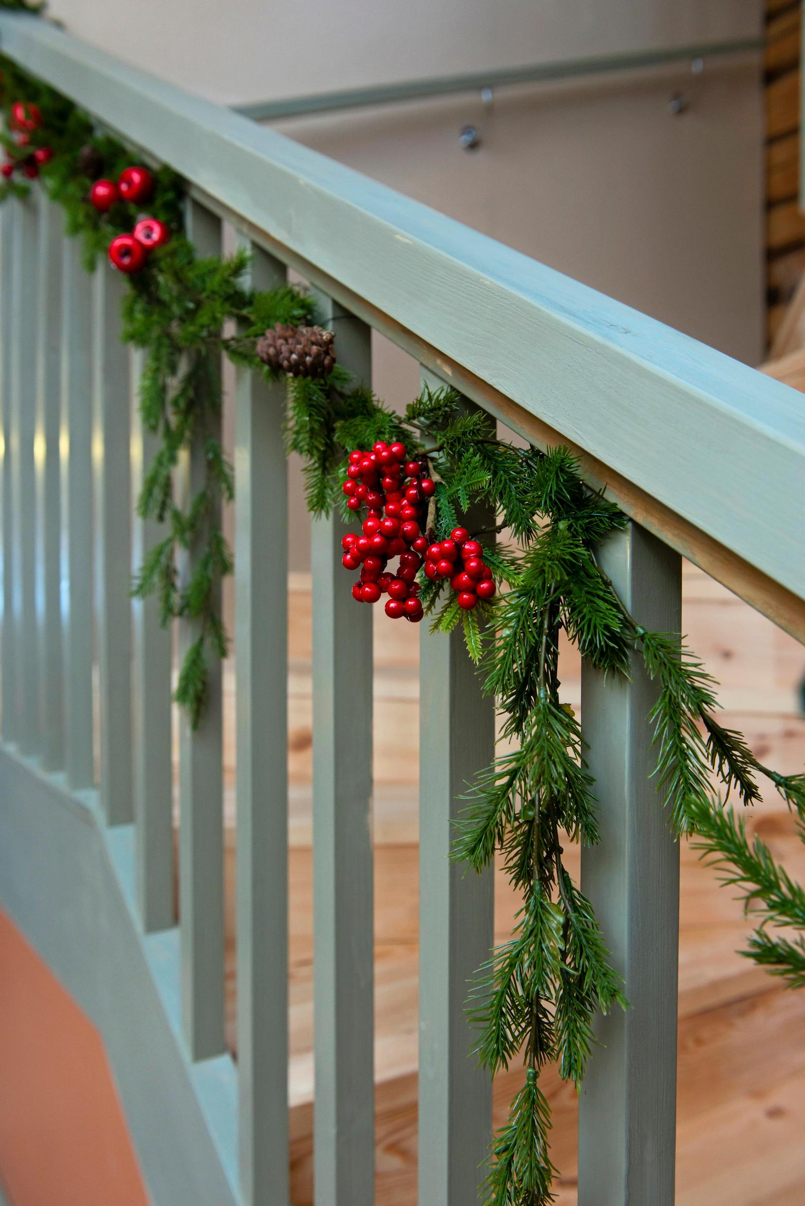 Evergreen garland on the stair banister