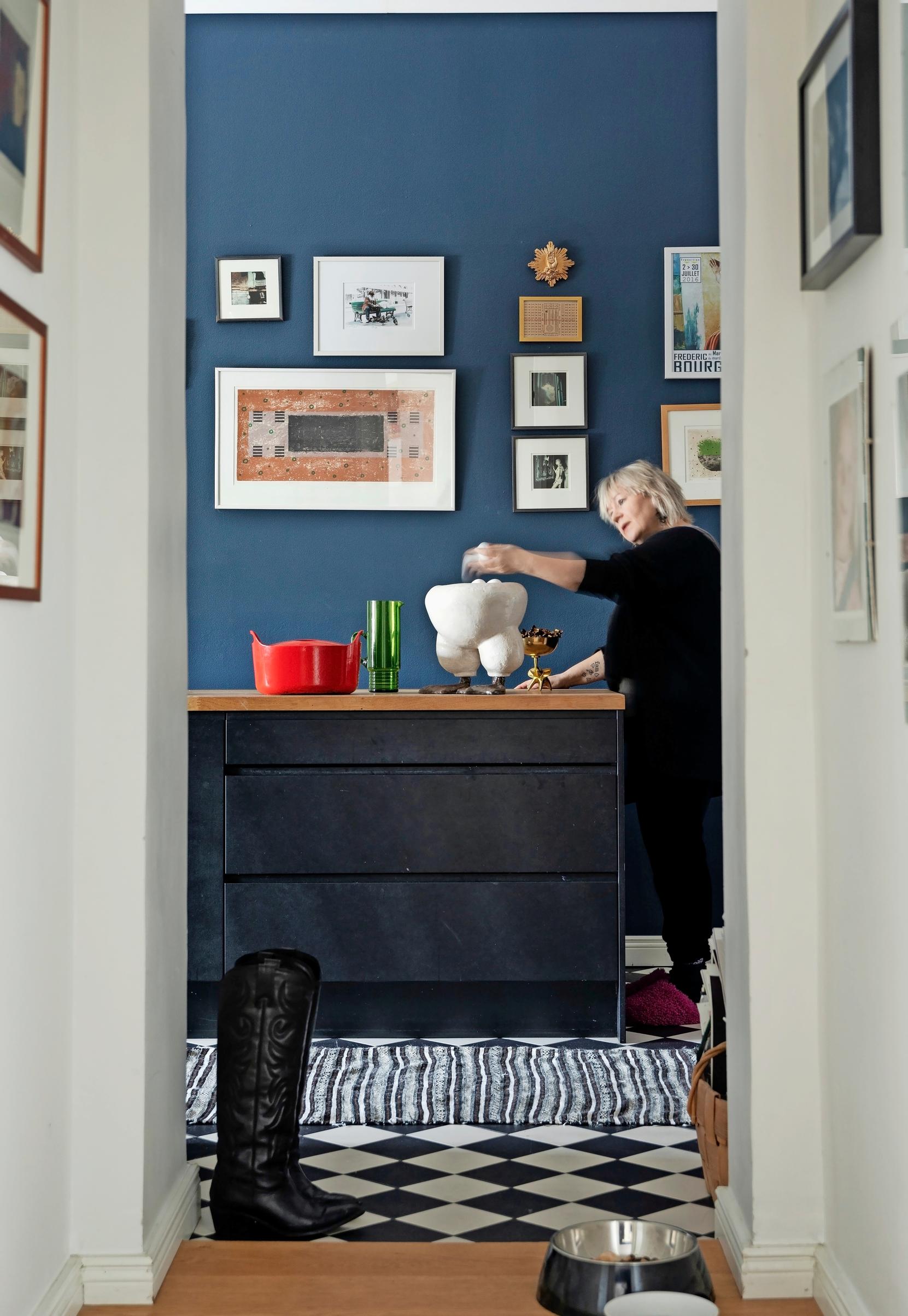 Kitchen with travel souvenirs on the wall.
