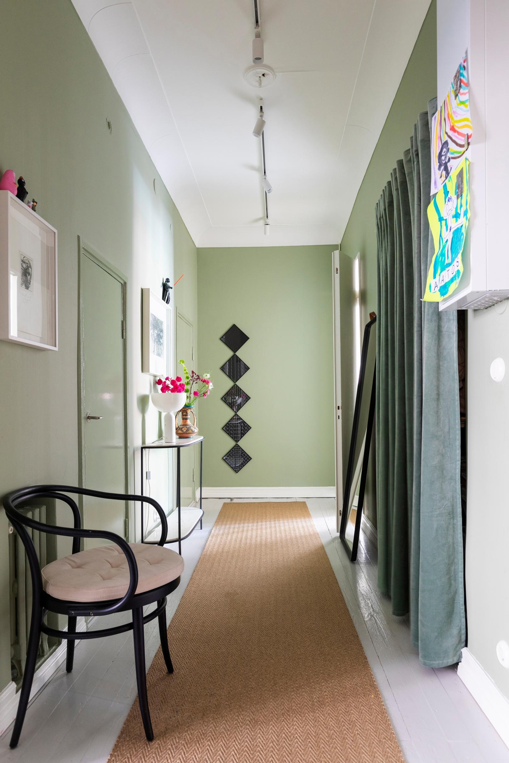 A velvet curtain replacing a sliding door in the entryway closet