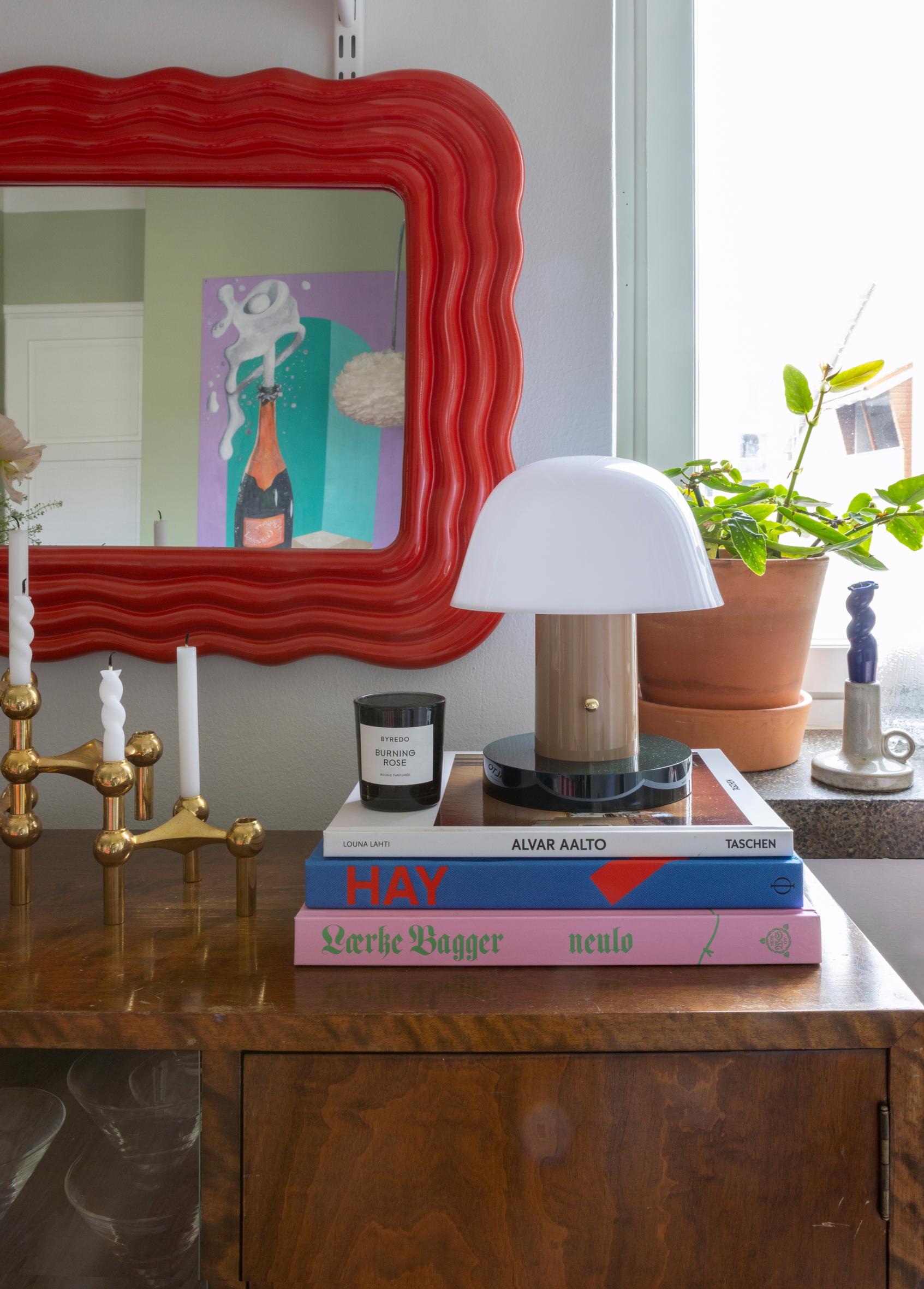 Red mirror and table lamp