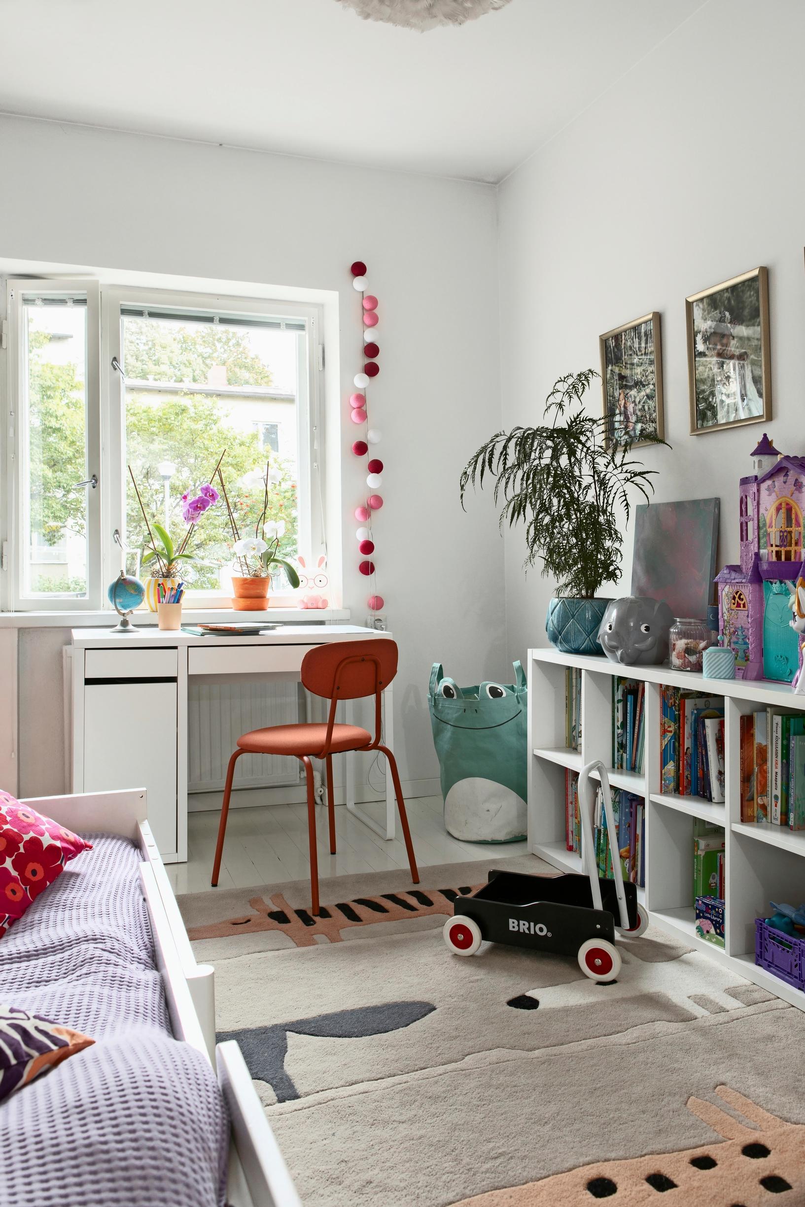 The children’s room with a bookshelf and a desk