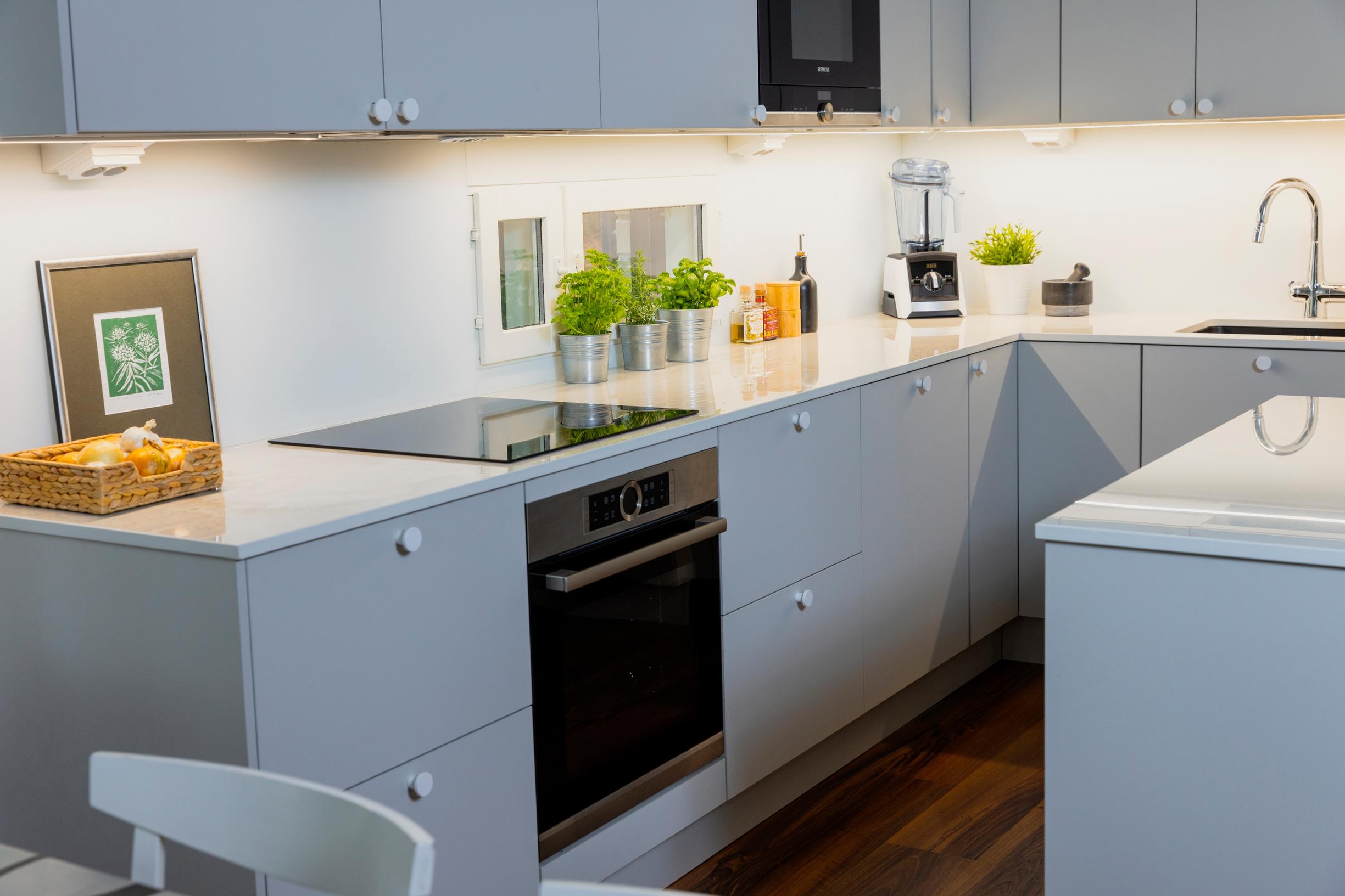 Temal’s greige shade on the kitchen cabinets