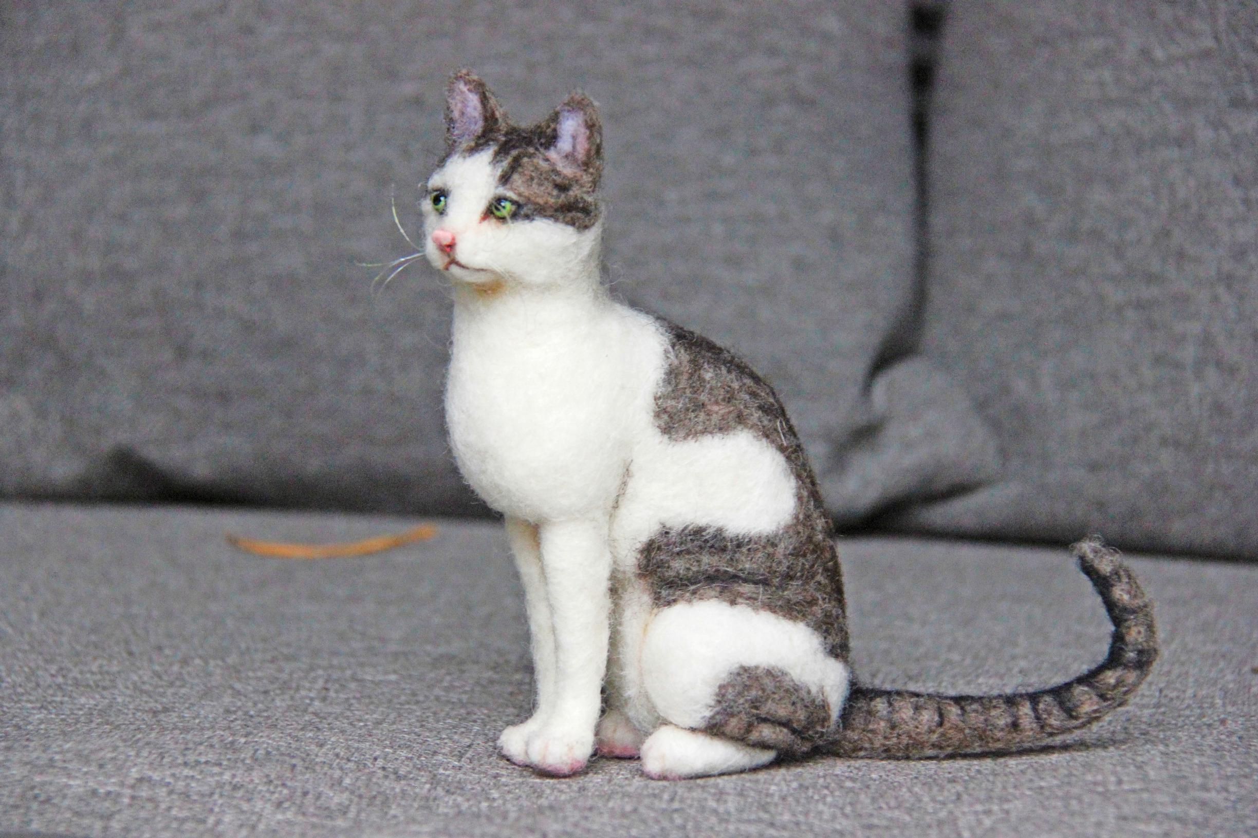 A felted calico cat