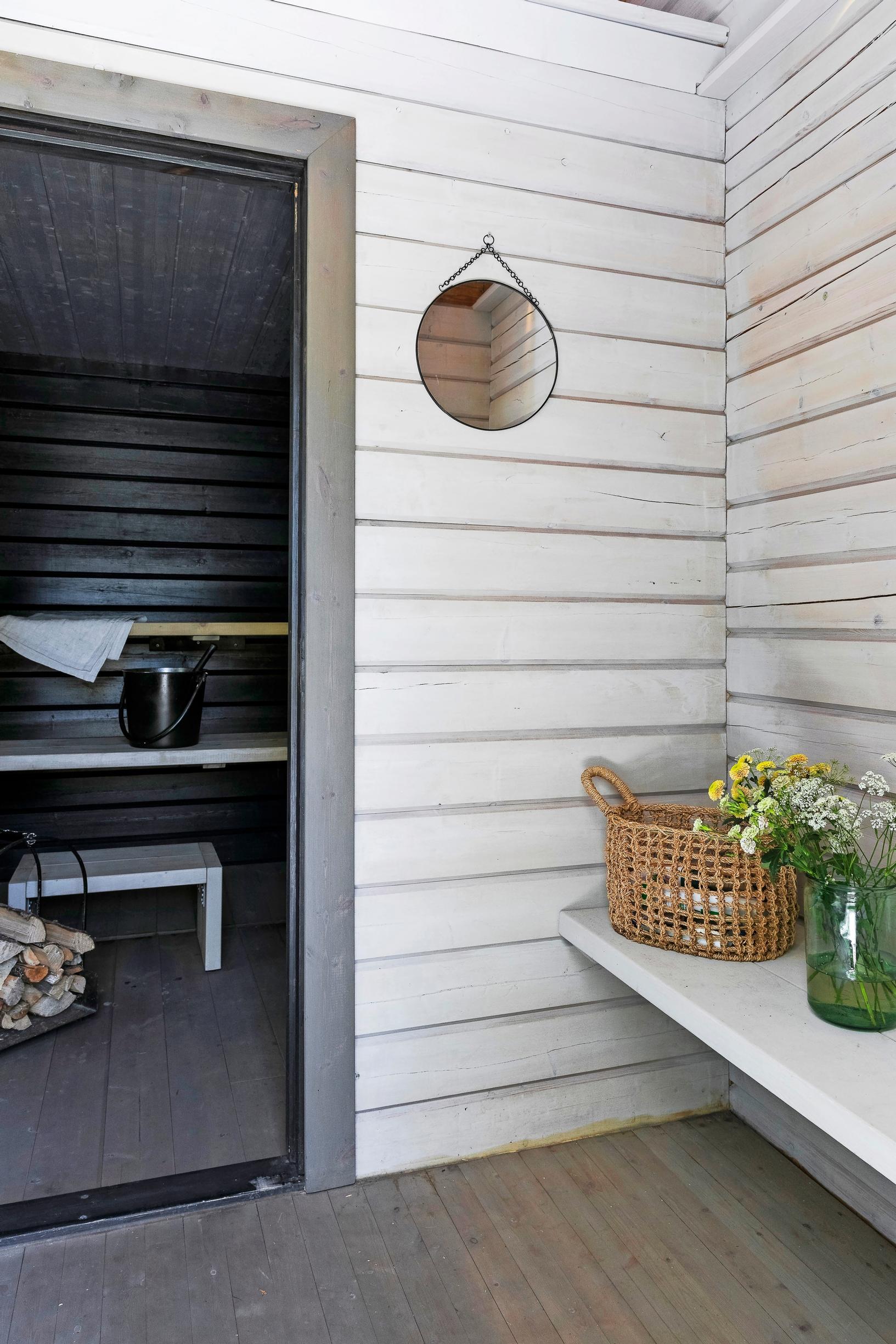 A wall-to-wall built-in countertop installed in a compact sauna entrance