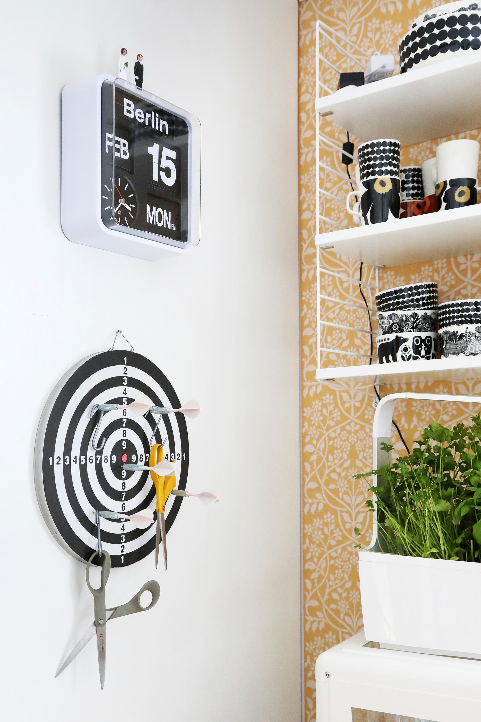 A dartboard used as a scissor holder