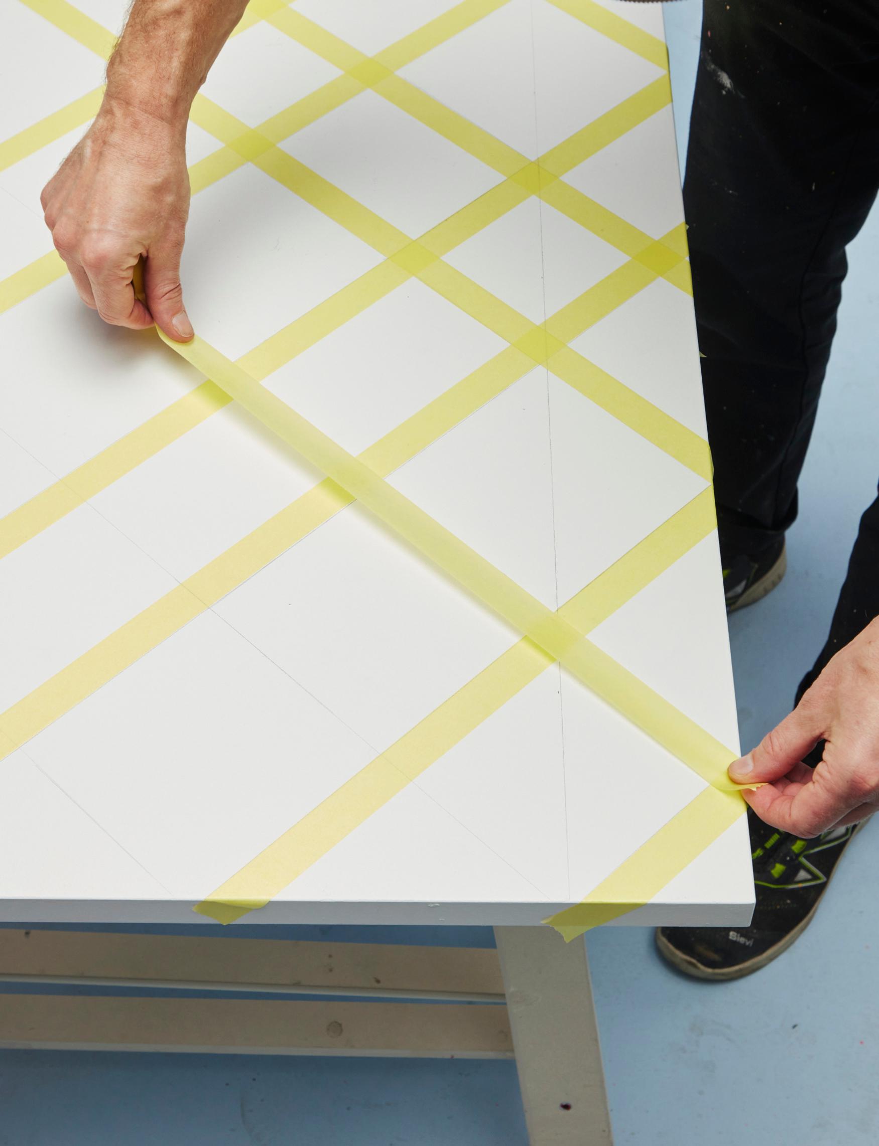 Mask off the squares you want to paint with tape.