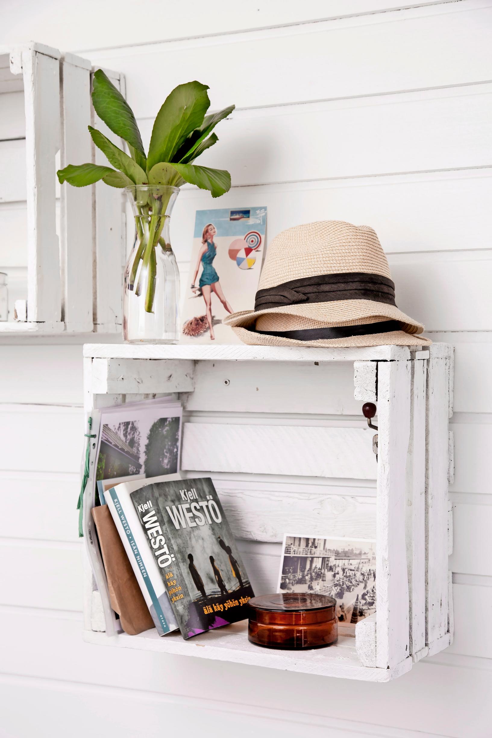 A shelf arrangement made of old painted potato crates.