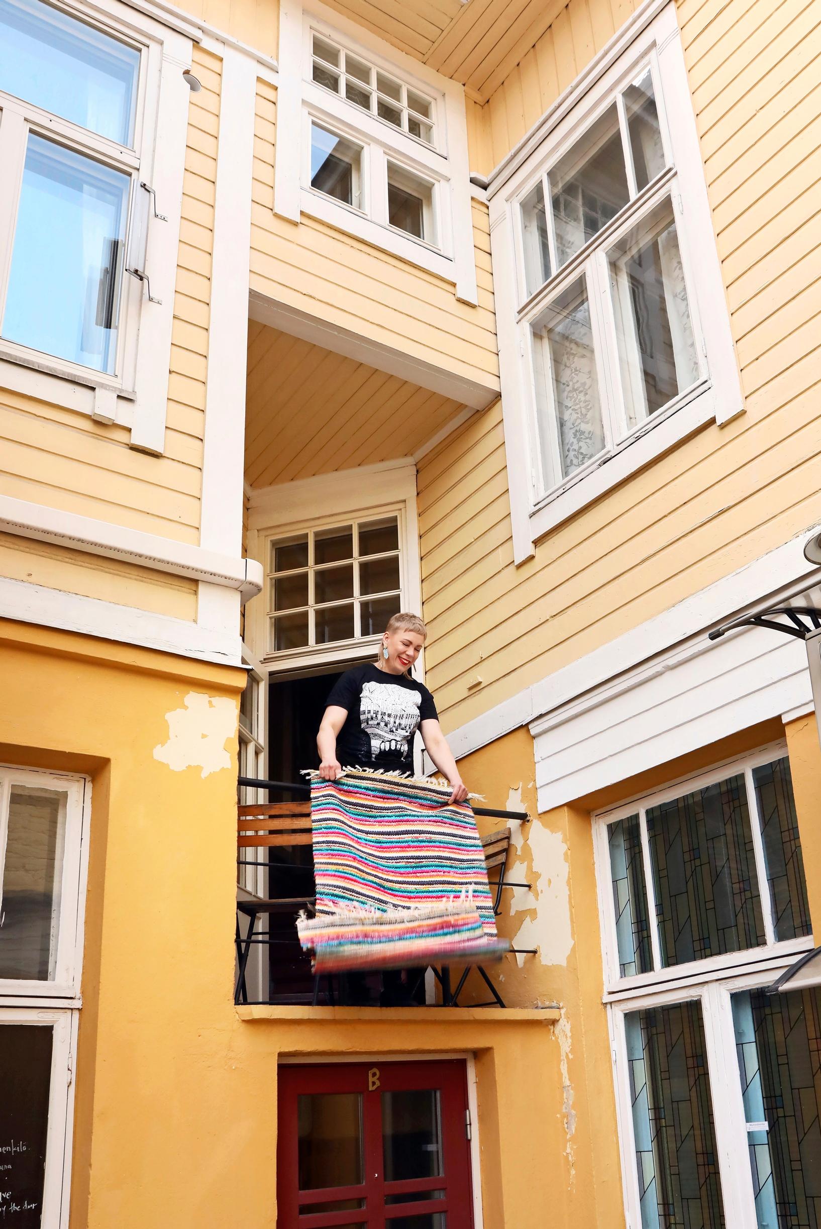 Airing balcony in a yellow old house