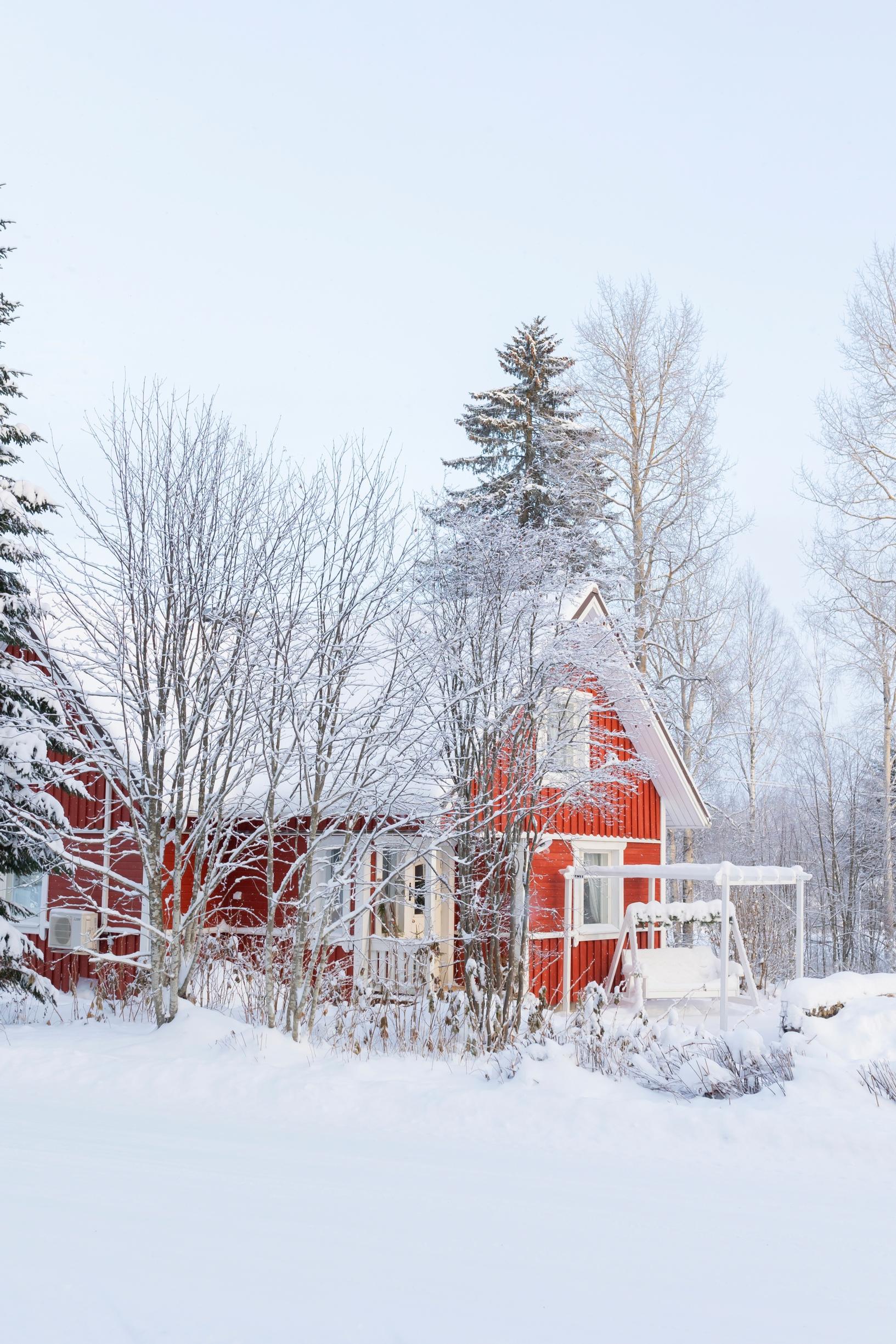 A red house in a winter landscape