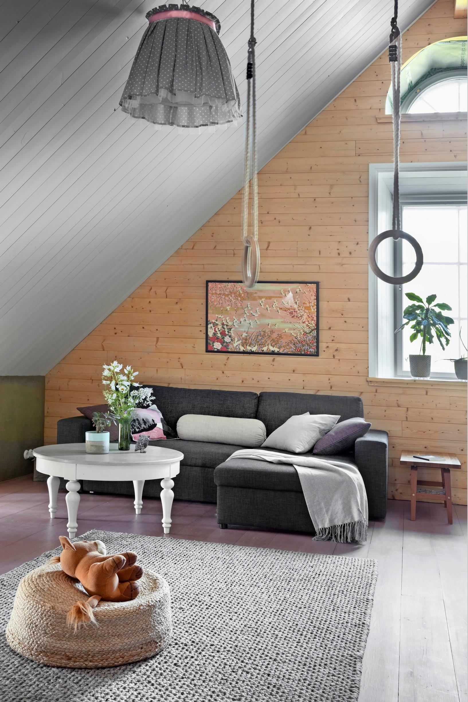 A tall everyday living room with a sloping ceiling