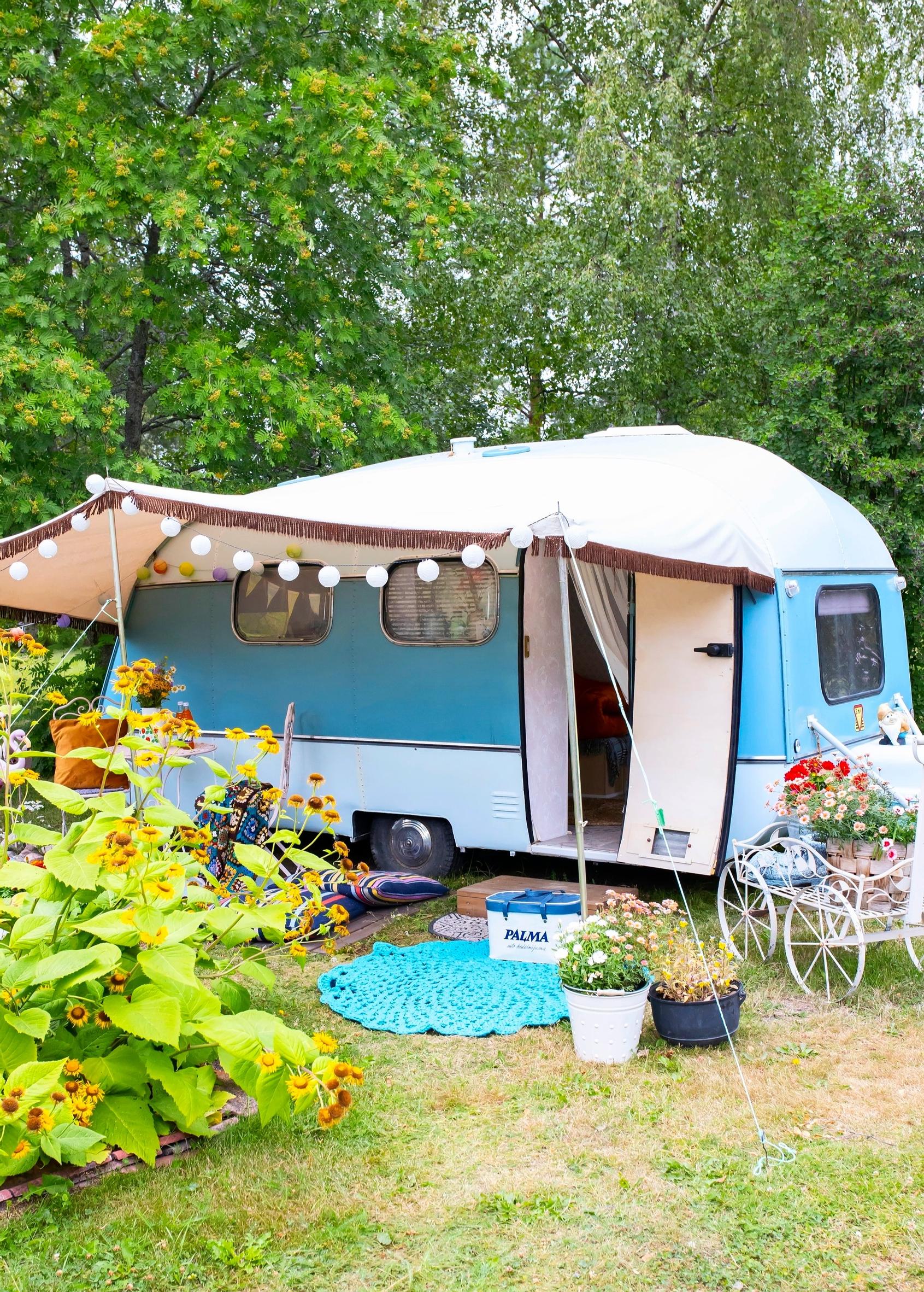 An old caravan and a garden canopy