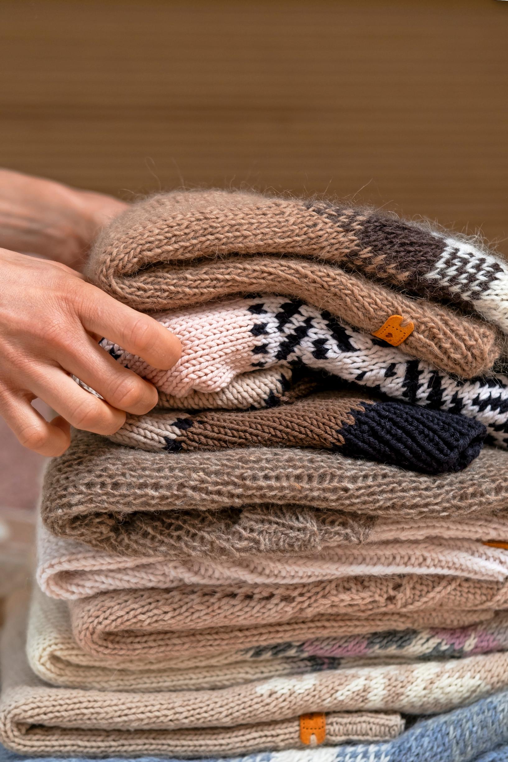 A stack of knitted items by Kaisa Mäkäräinen.