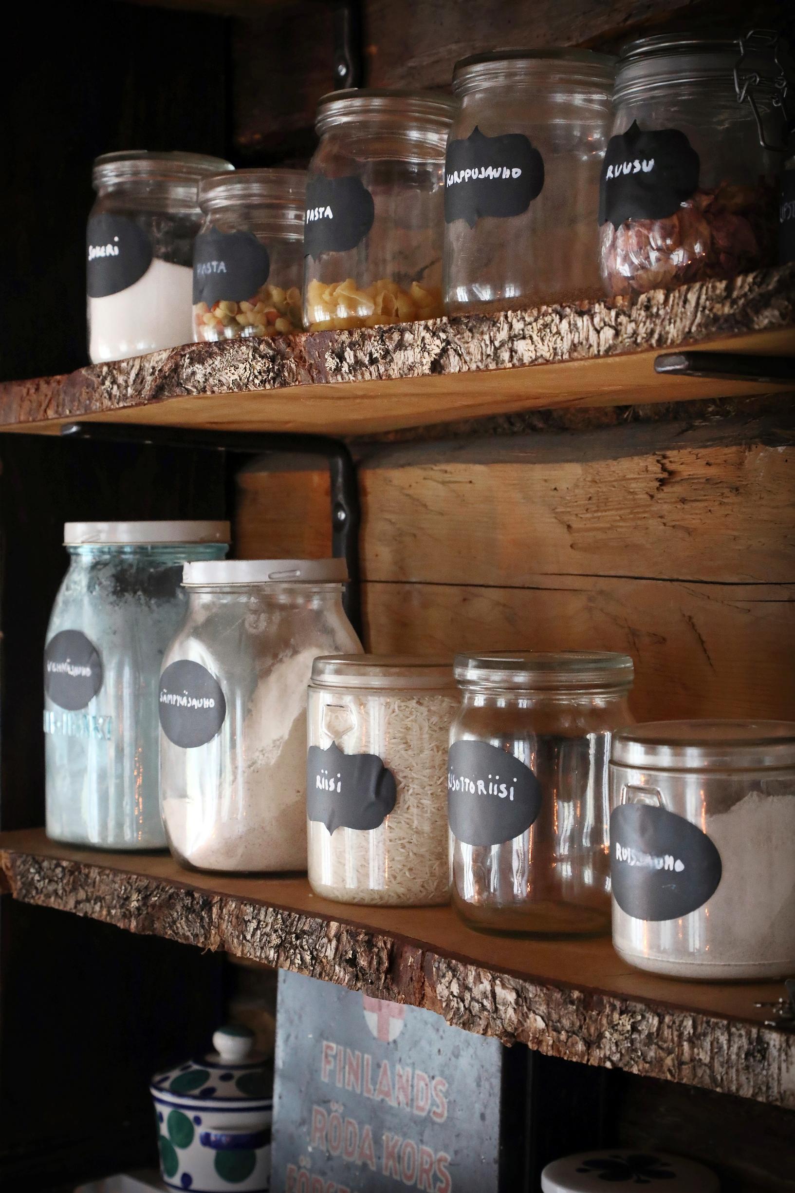 Kitchen shelves sawed from old planks and glass jars.