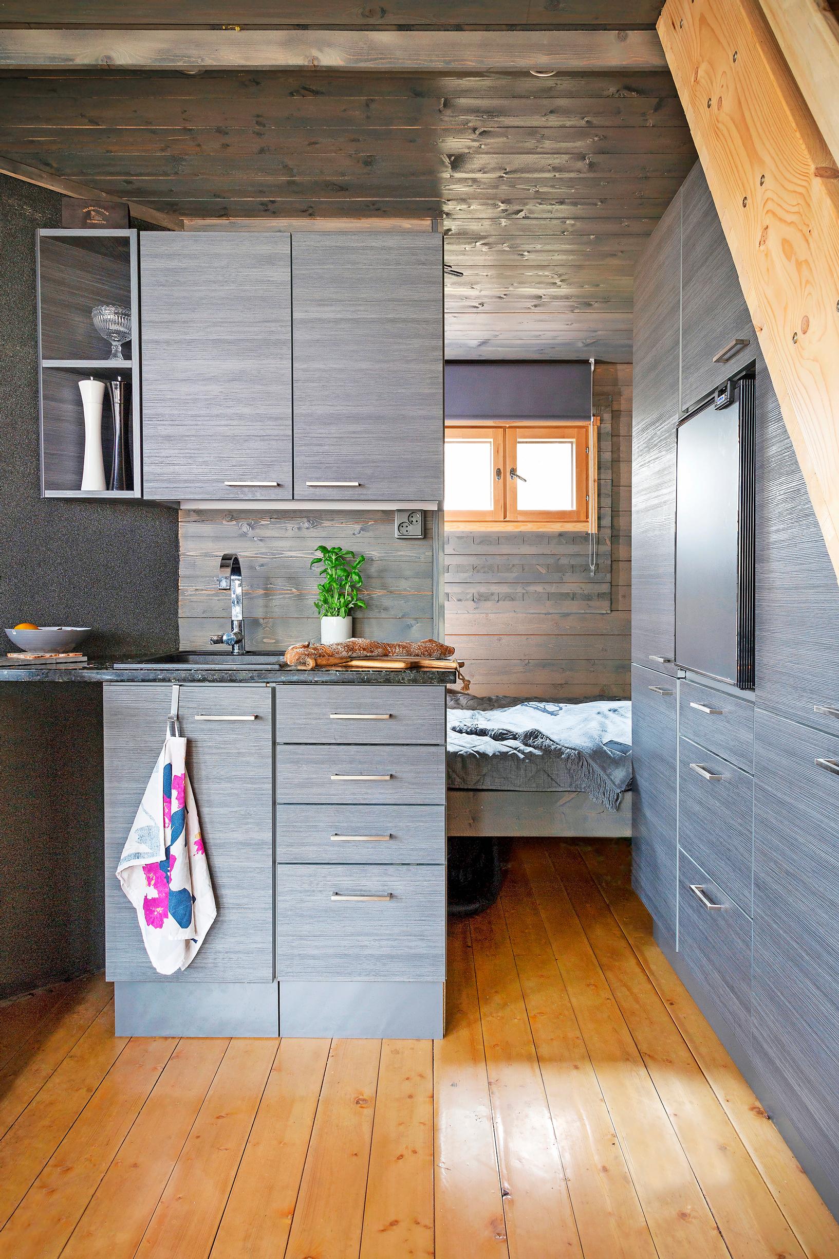 Gray kitchenette and sleeping alcove