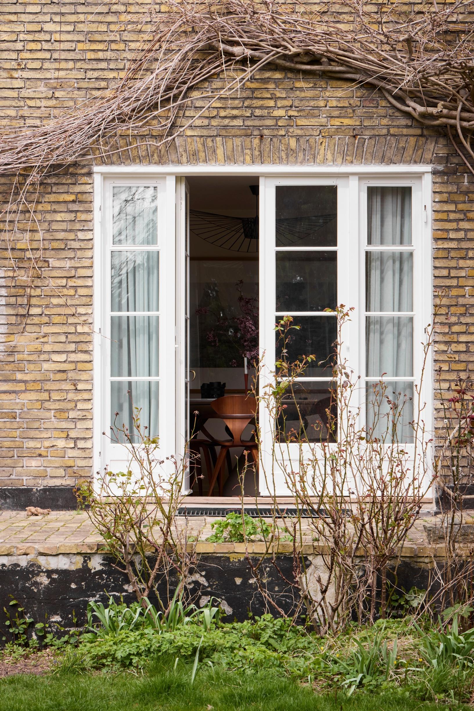 French doors leading to the garden in the old brick house
