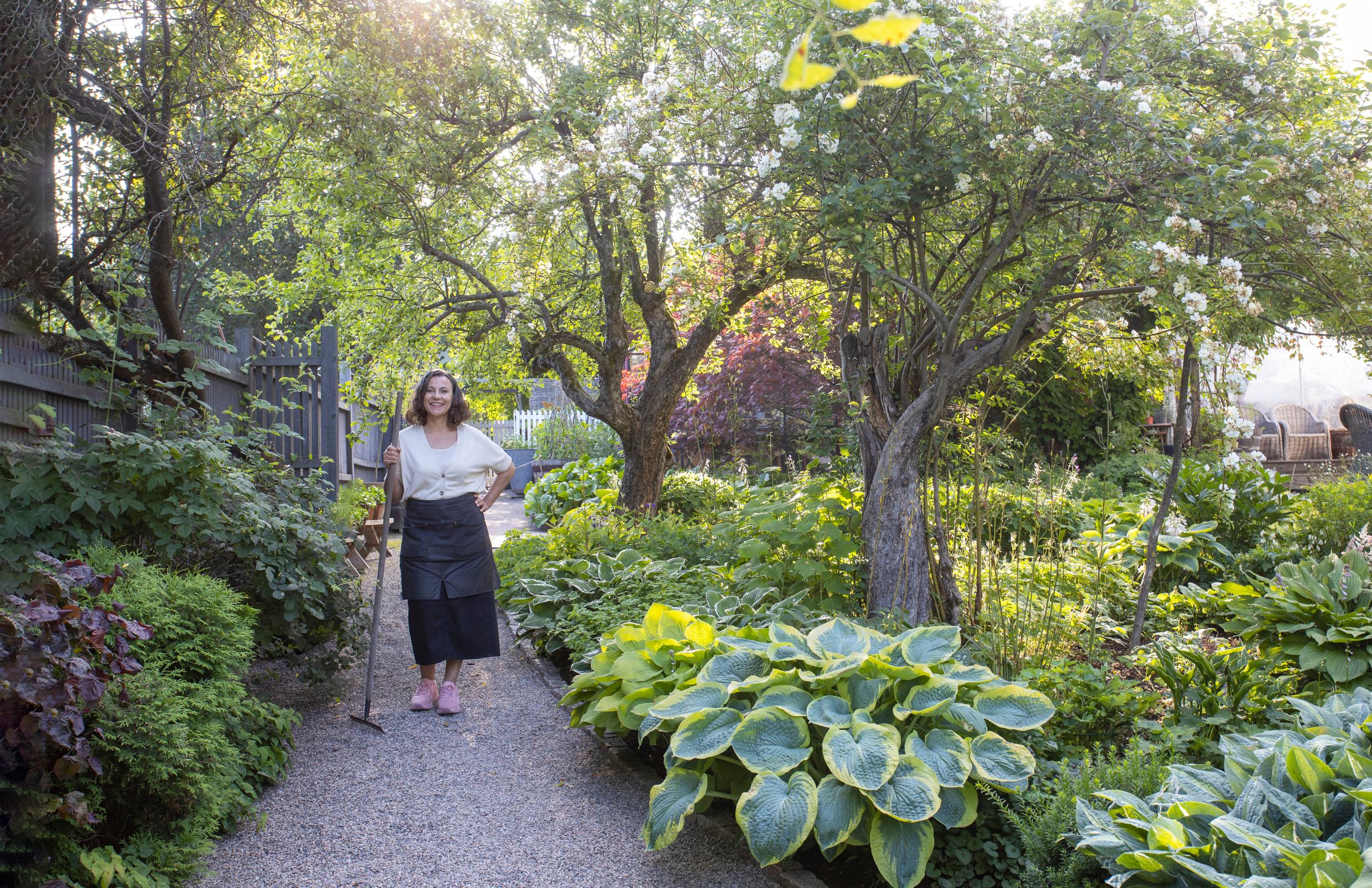 Charlotte rakes the garden paths every day.