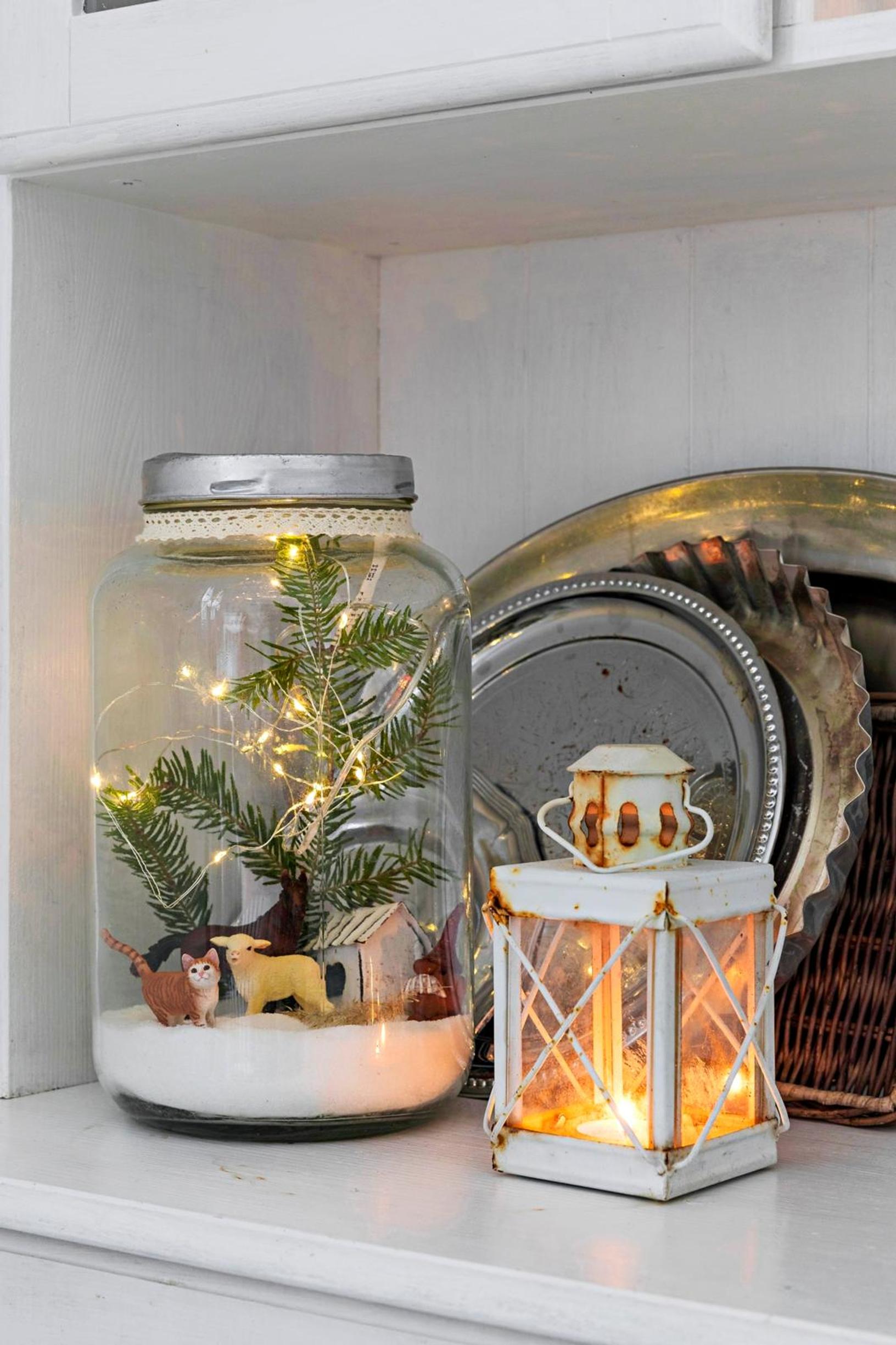 a string of lights and a display in a glass jar