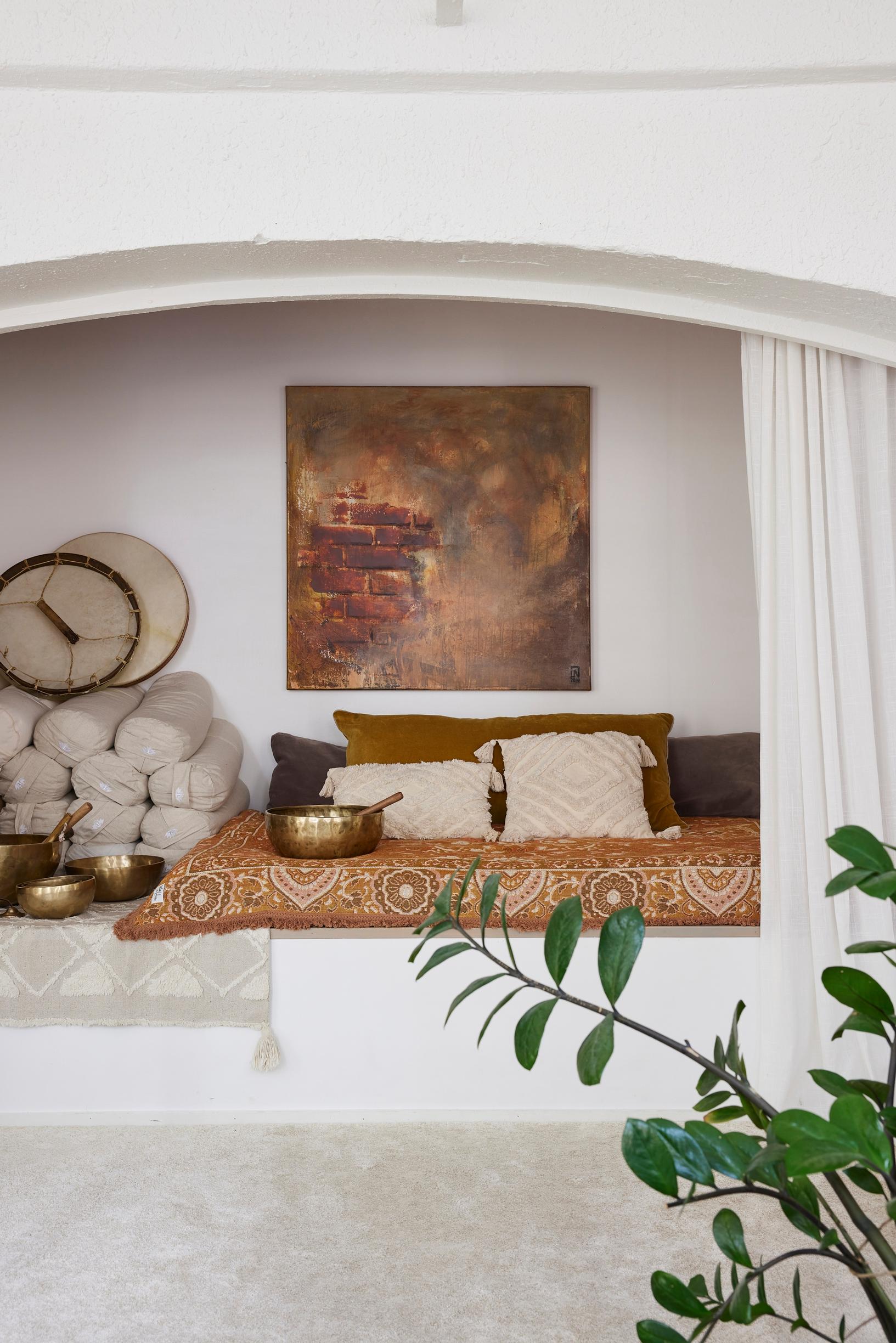 a niche in the wall with yoga accessories