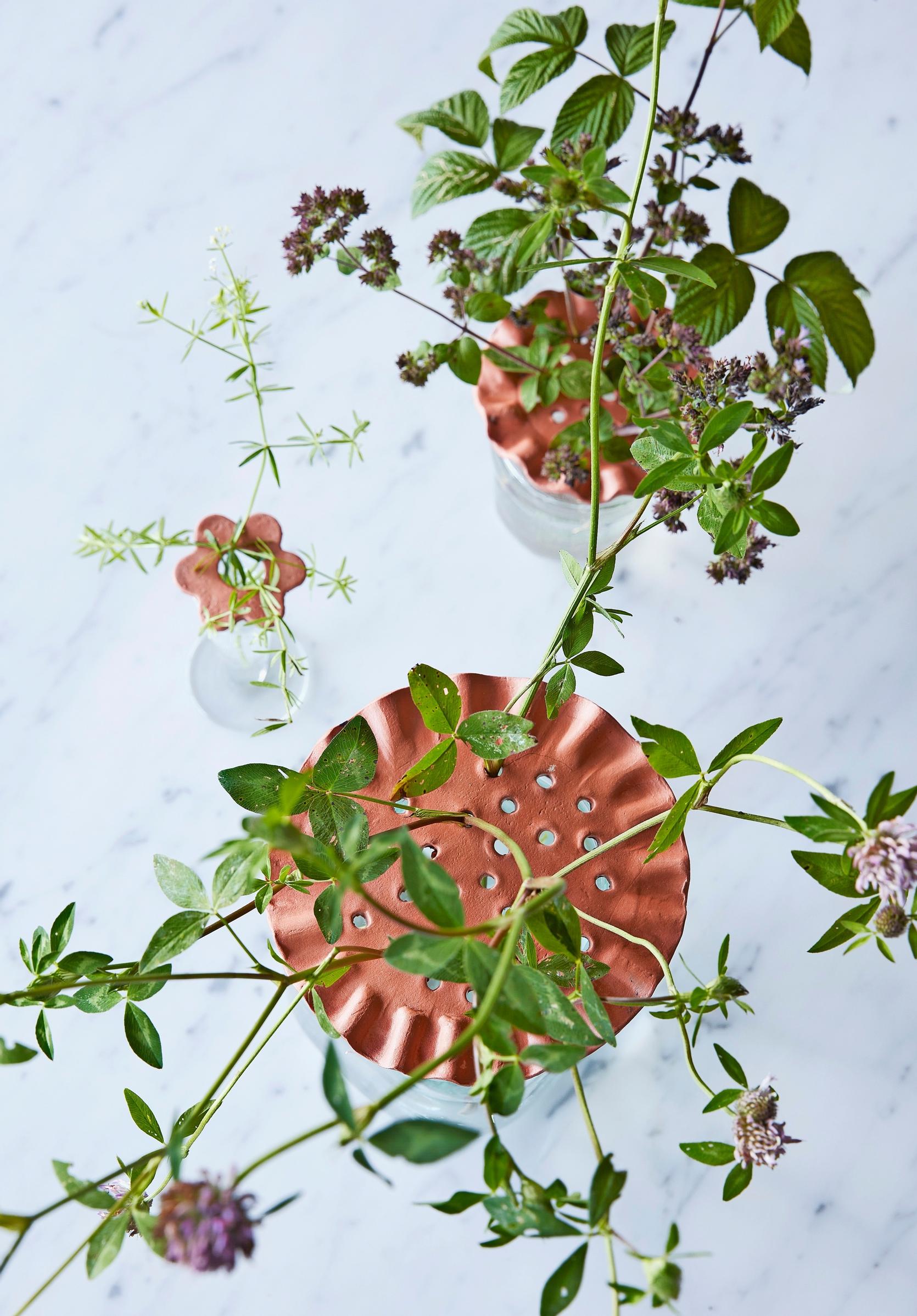 Flower supports made from air-dry clay.