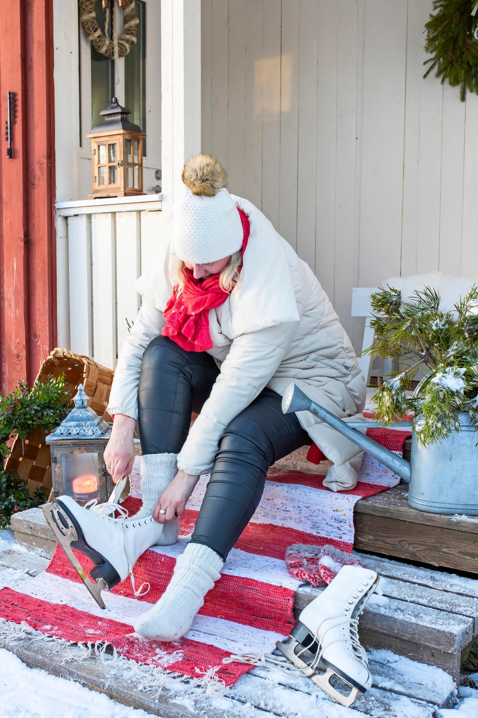Putting on skates on the sauna steps