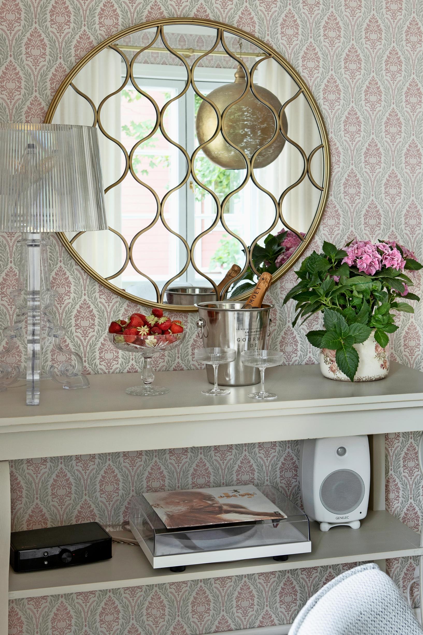 round mirror and side table