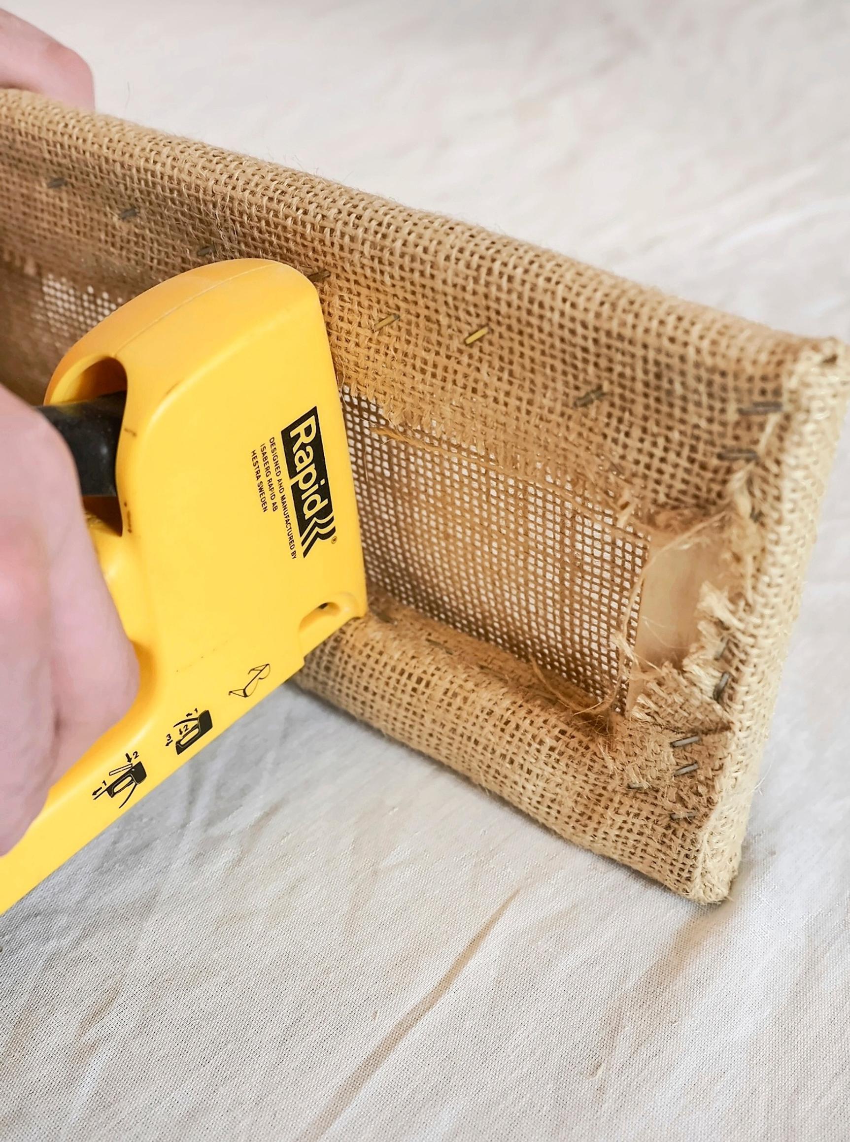 Covering the bedside table drawer with jute fabric