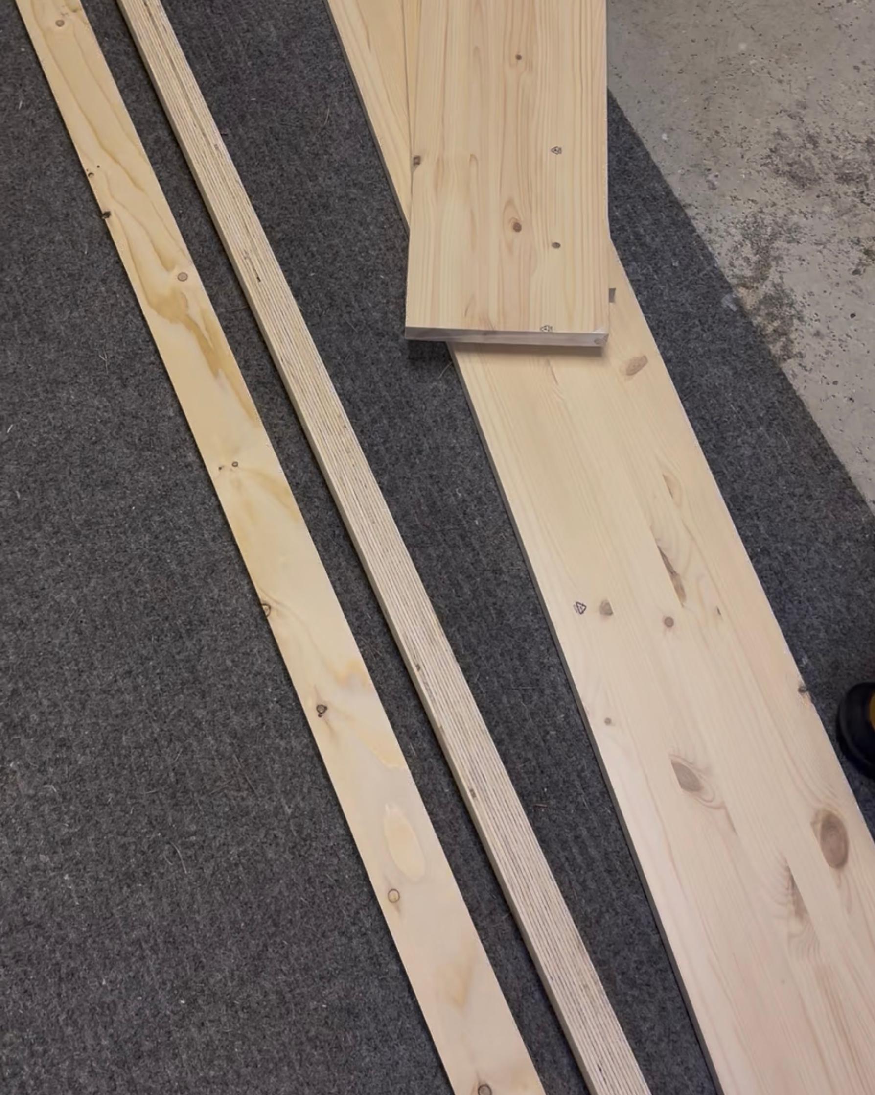 Wooden materials on a gray rug
