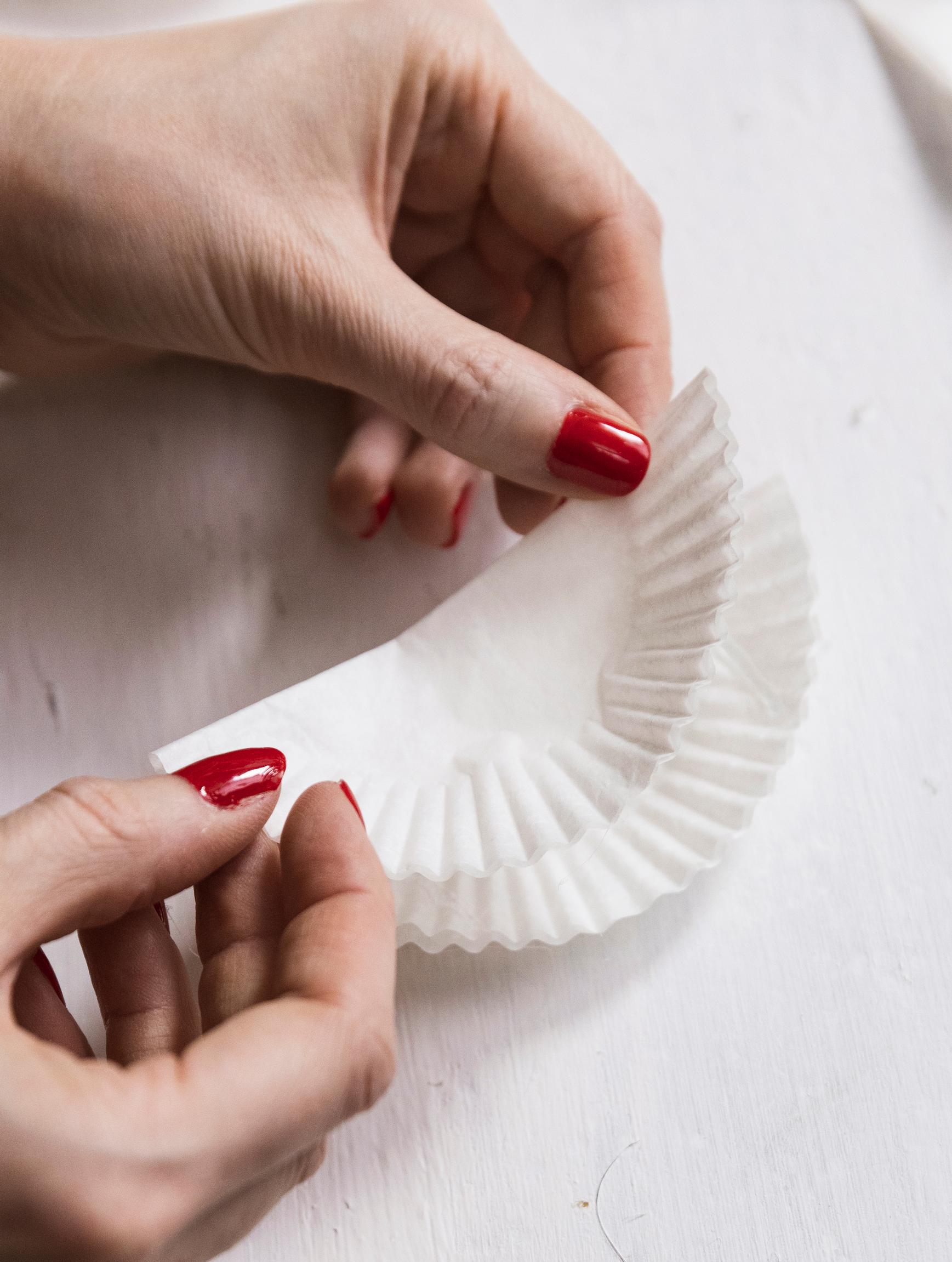 Gluing the cupcake liners one upon the other