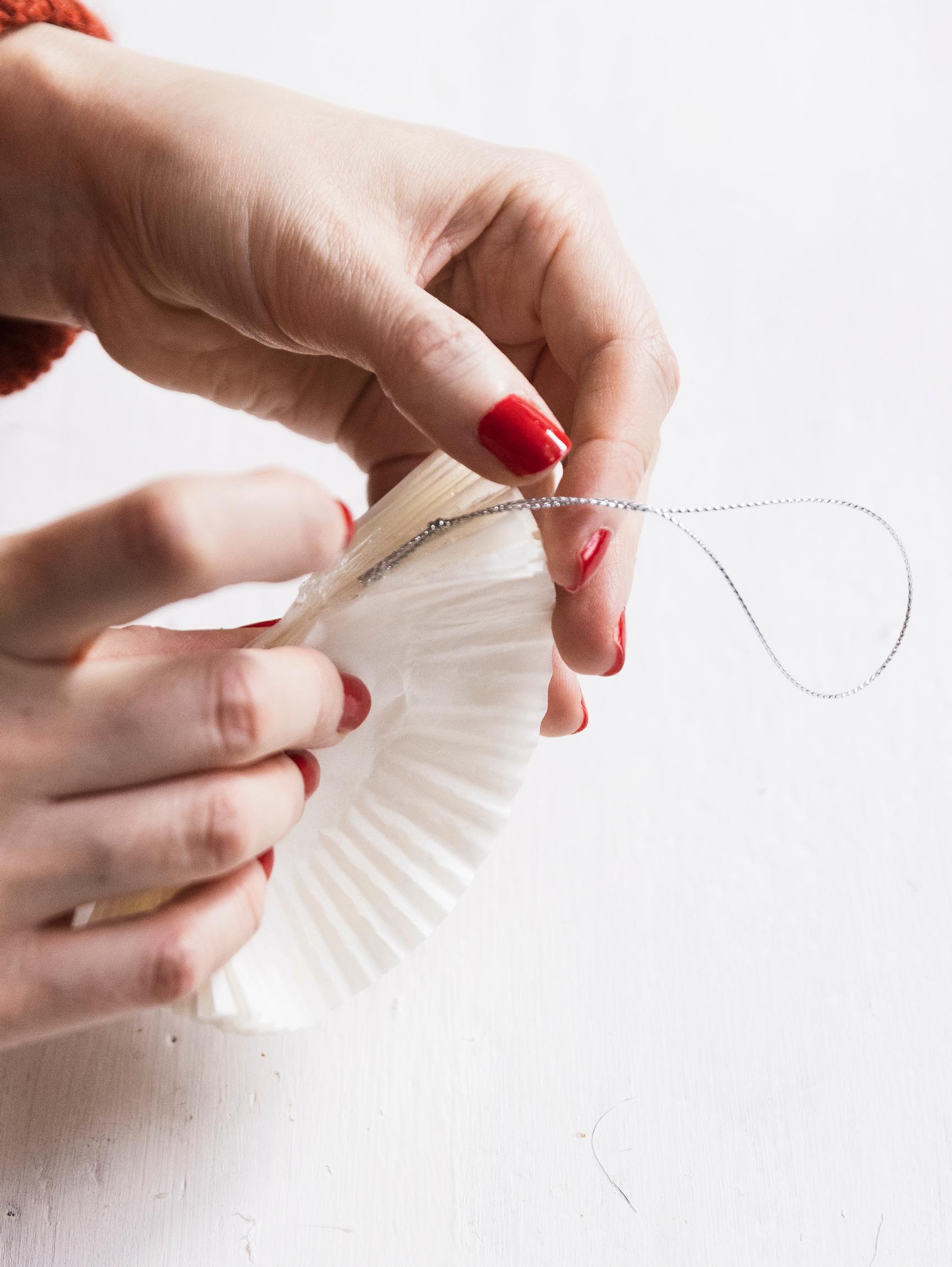 Gluing the hanging string into the fold